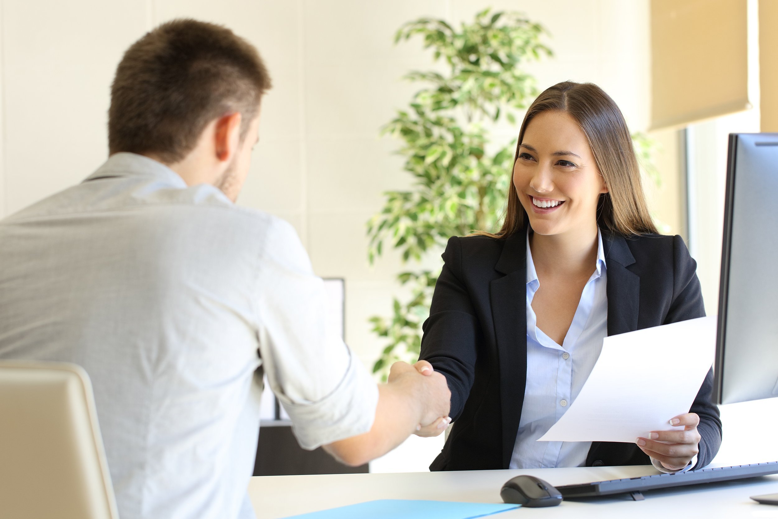 successful job interview with boss and employee handshaking