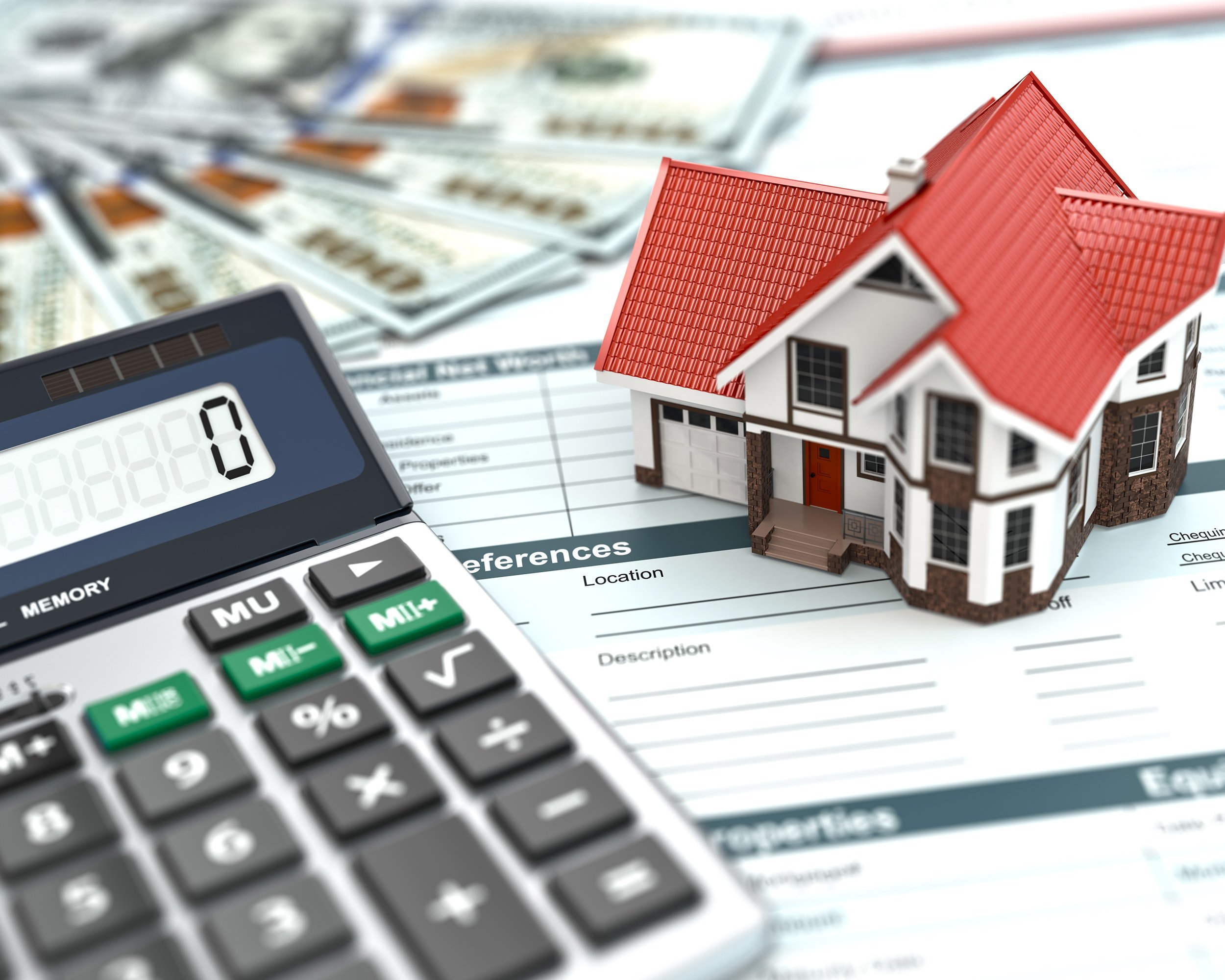 toy home, money, and calculator on mortgage