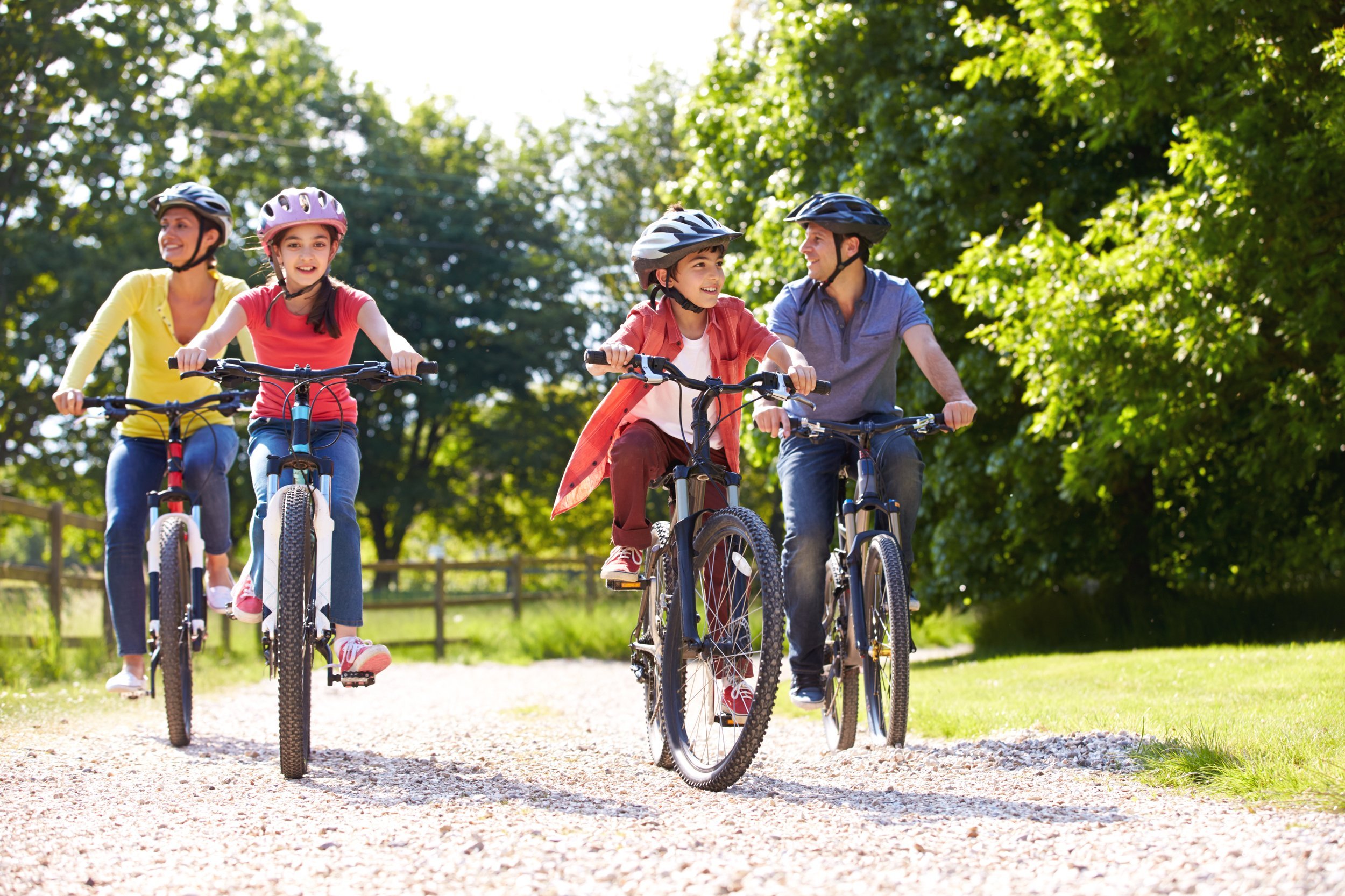 Hispanic family riding bikes