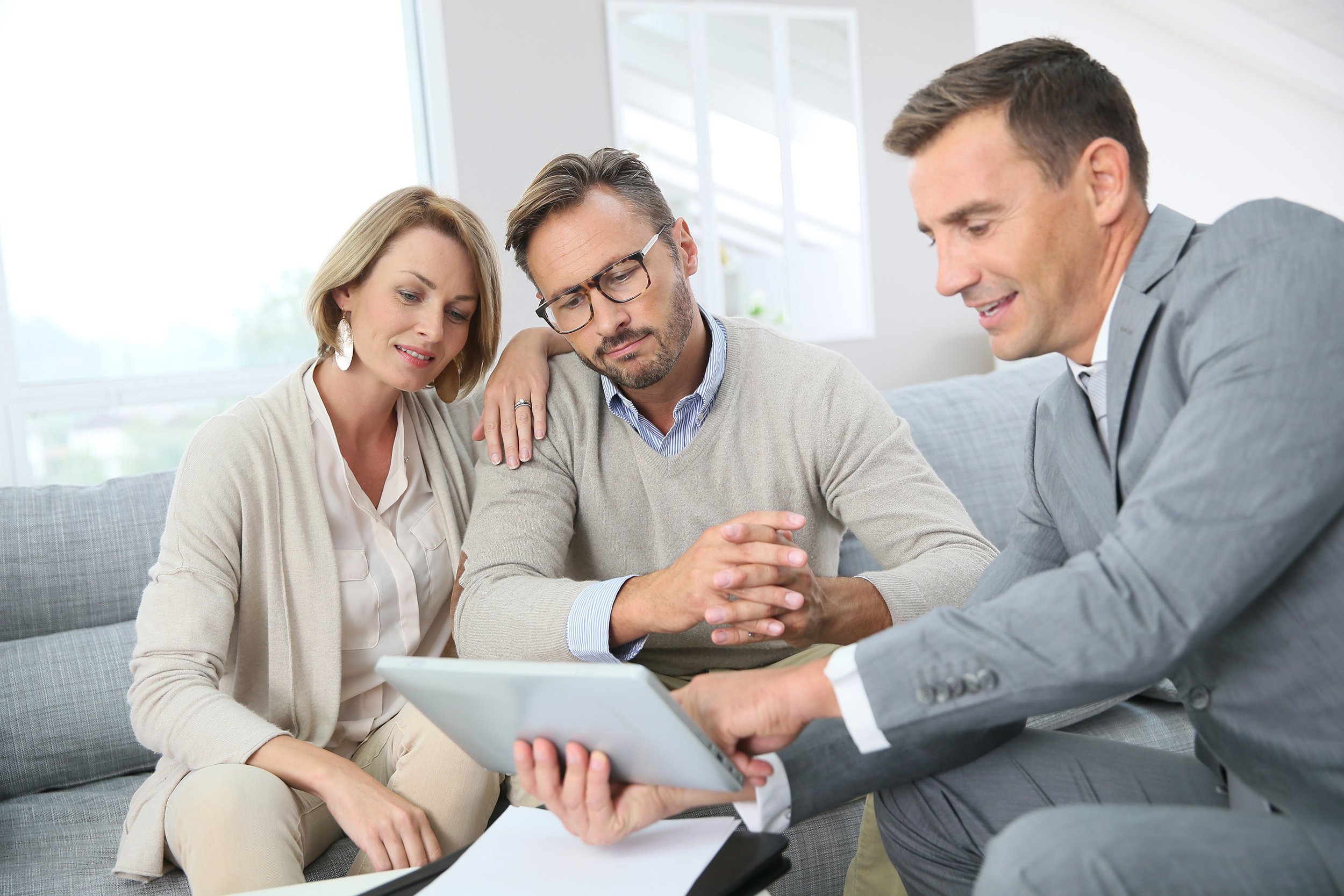 financial adviser showing terms of contract on tablet
