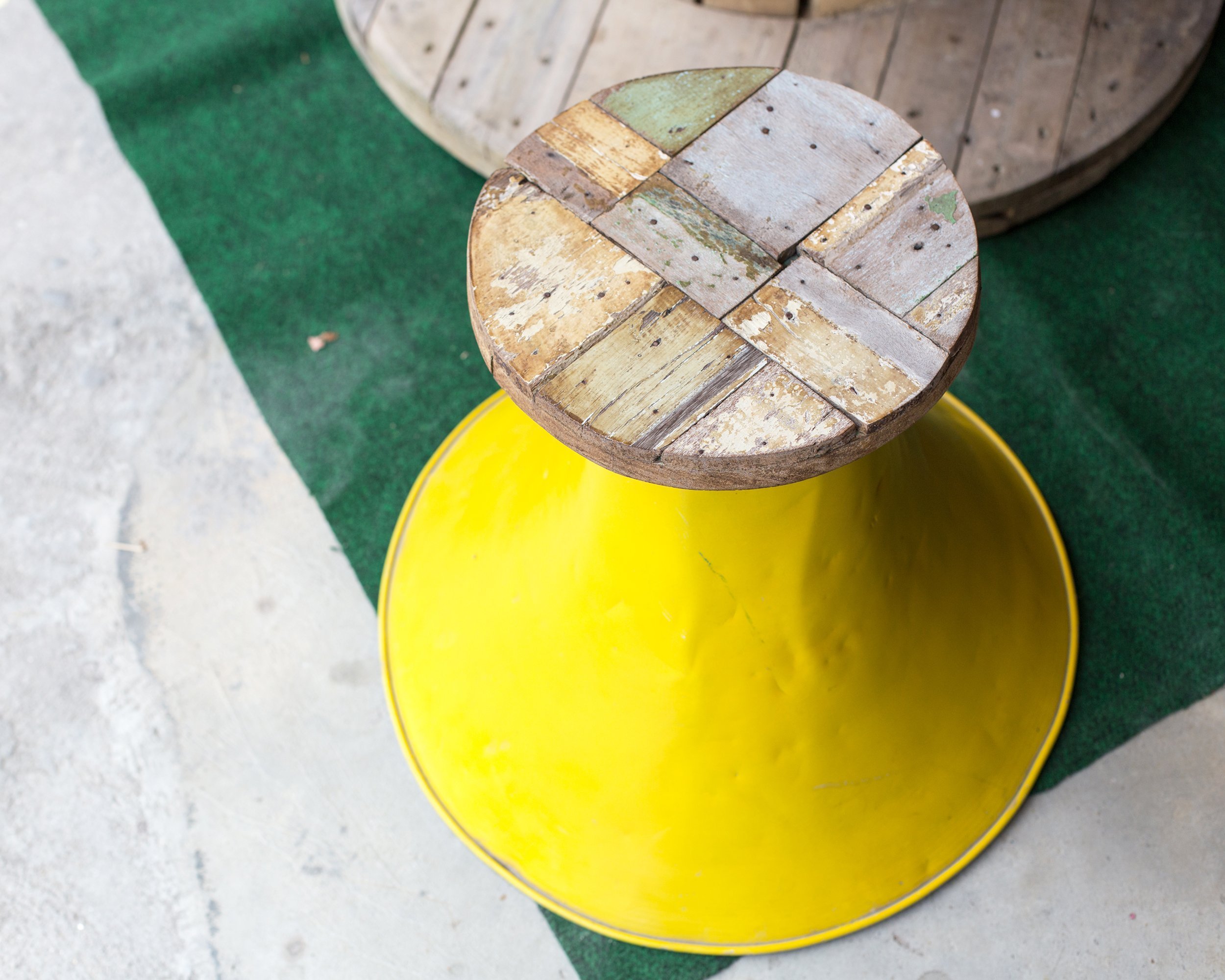 chair spray painted yellow on patio