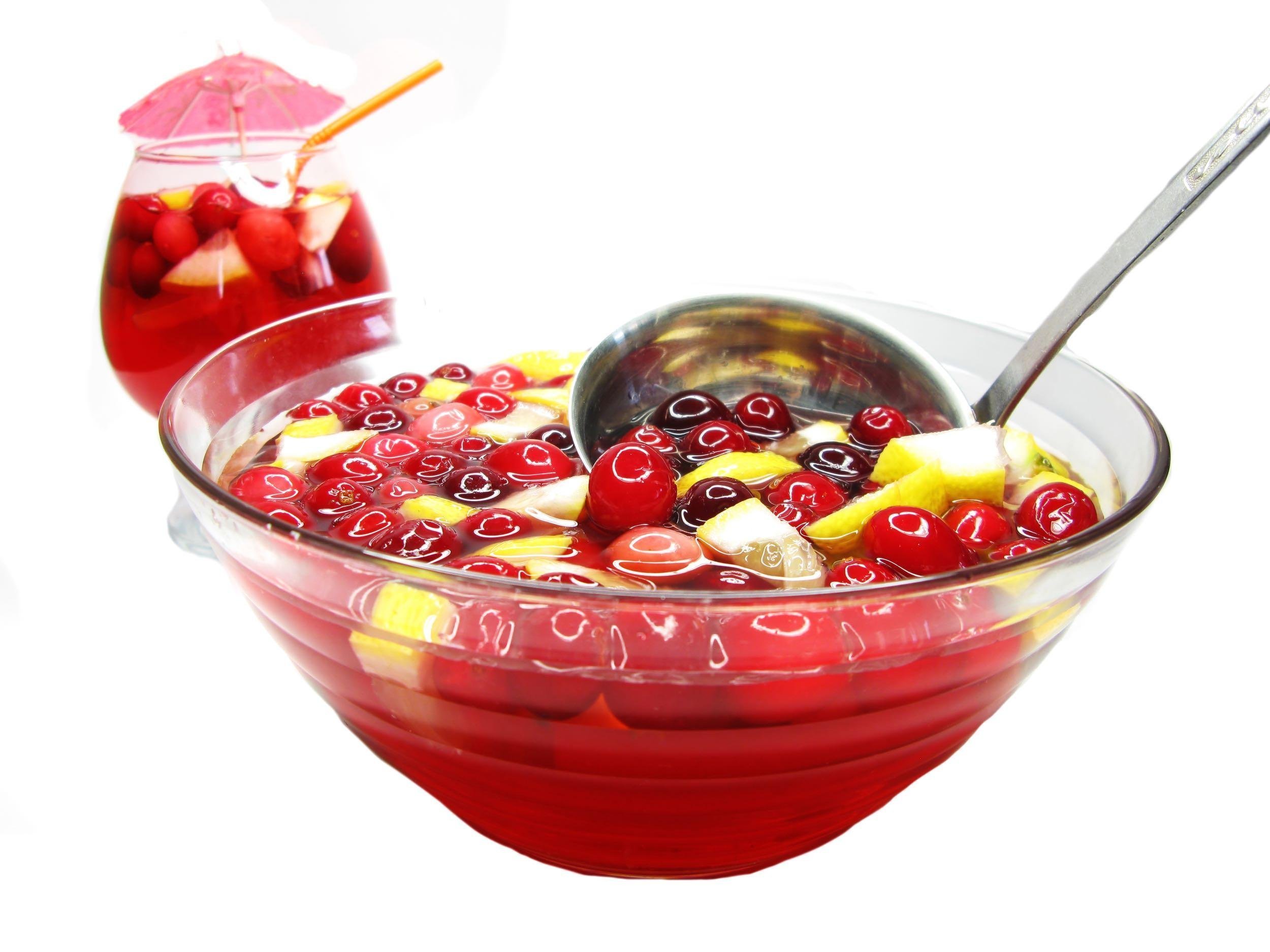 fruit cocktail punch in bowl with ice and fruit