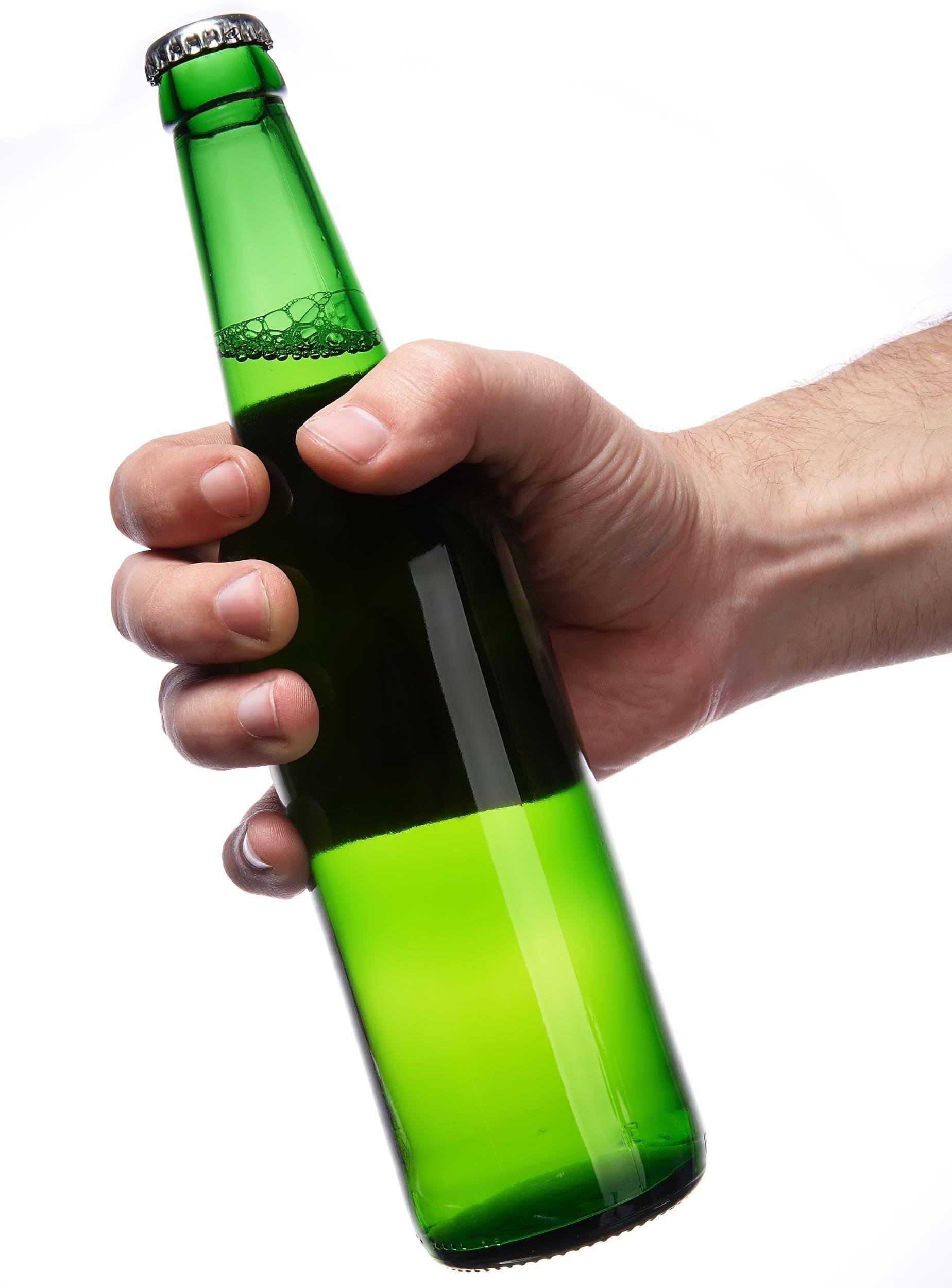 green beer bottle in hand