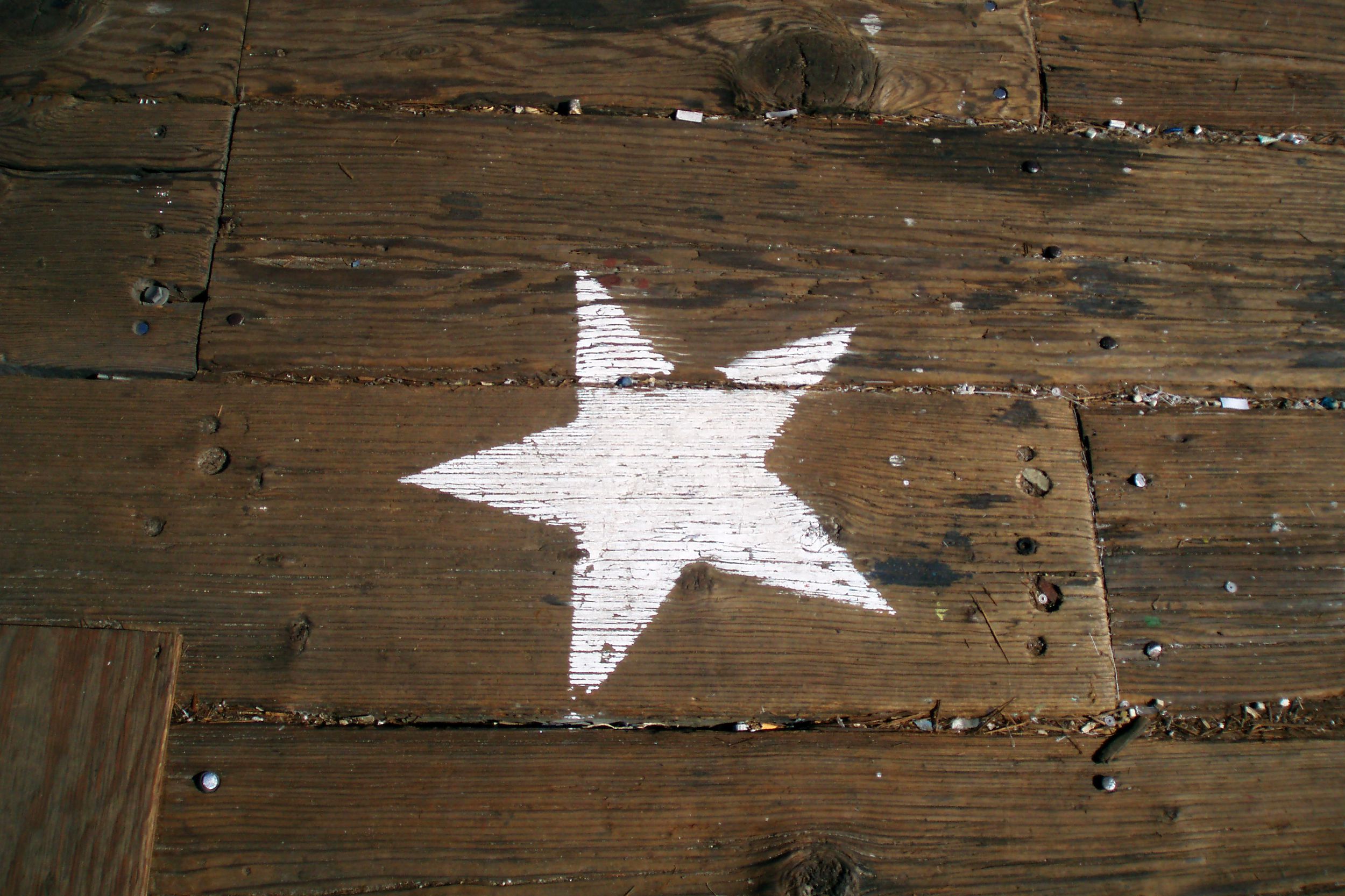 white painted star on boardwalk