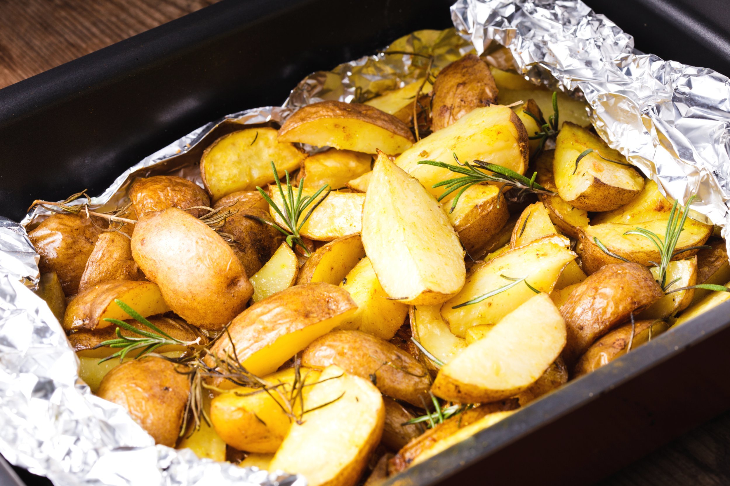Rusic style potato with rosemary baked in foil