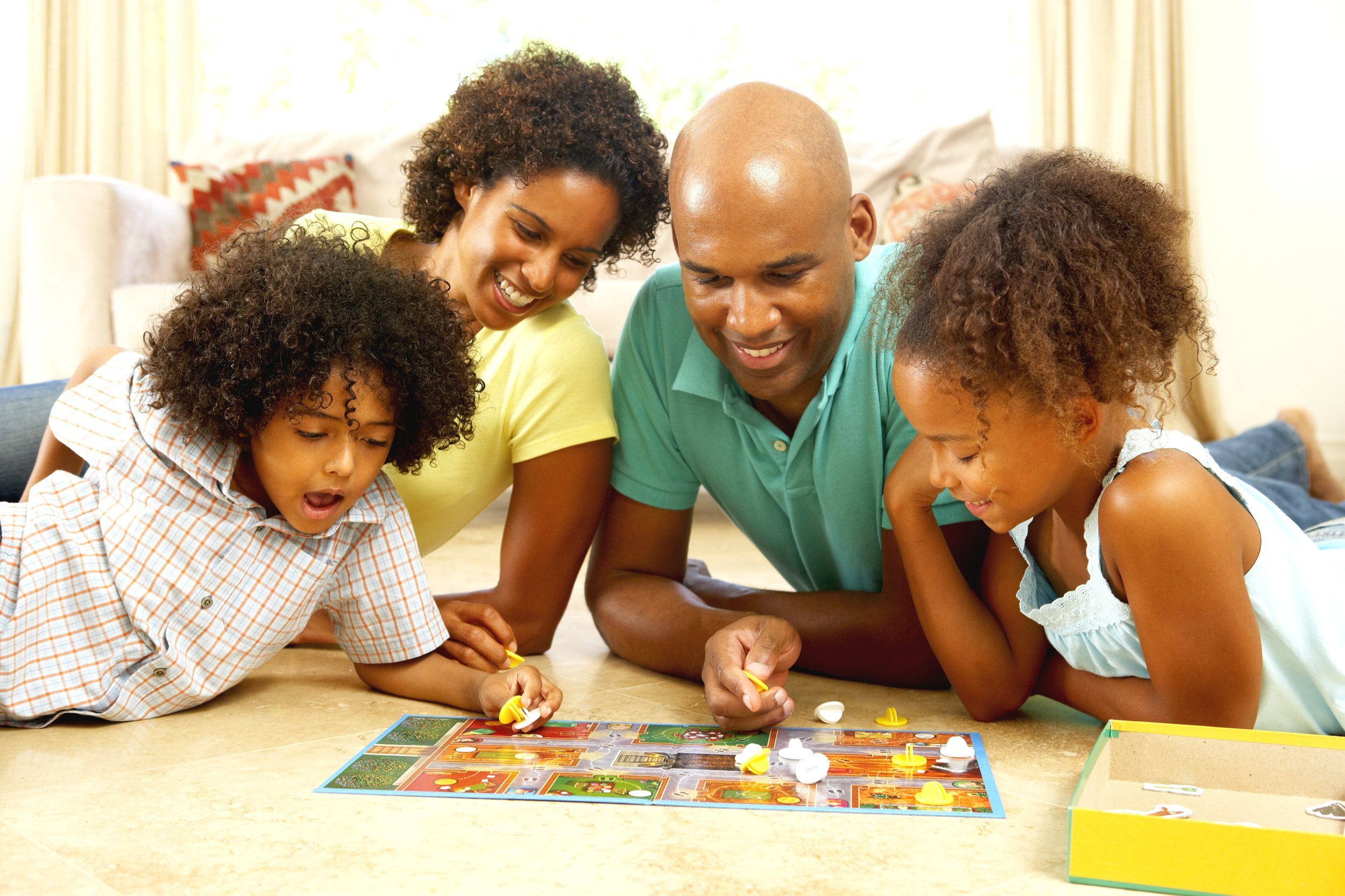 Family playing board games at home