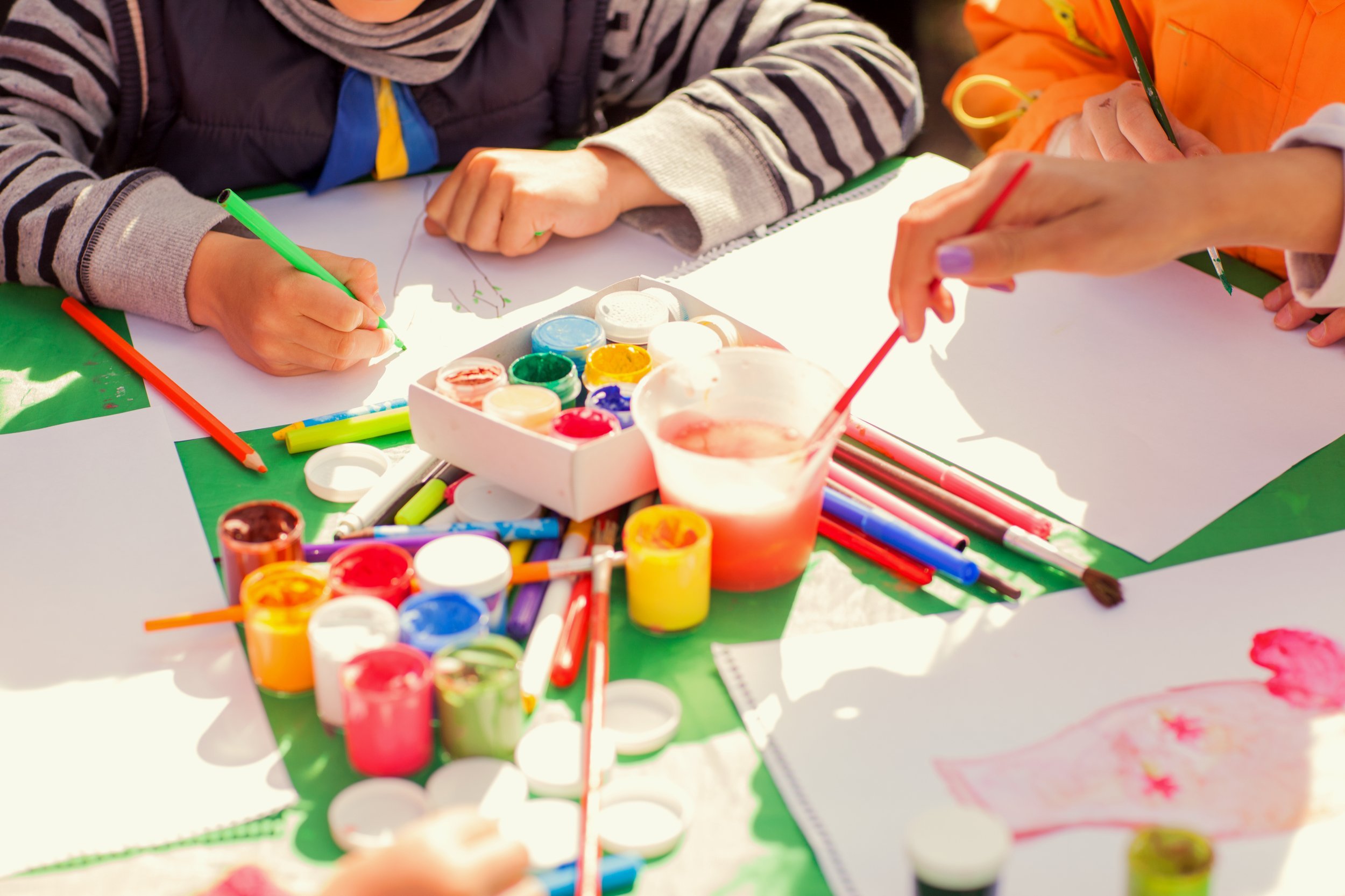 Children doing art project with paint