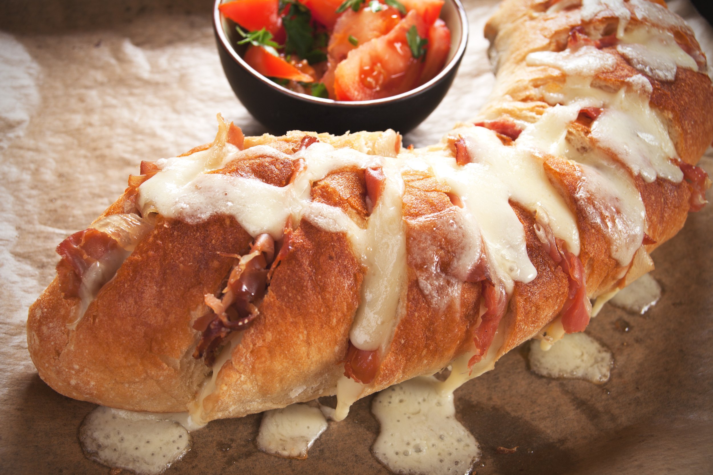 Homemade bread stuffed with prosciutto and mozzarella cheese