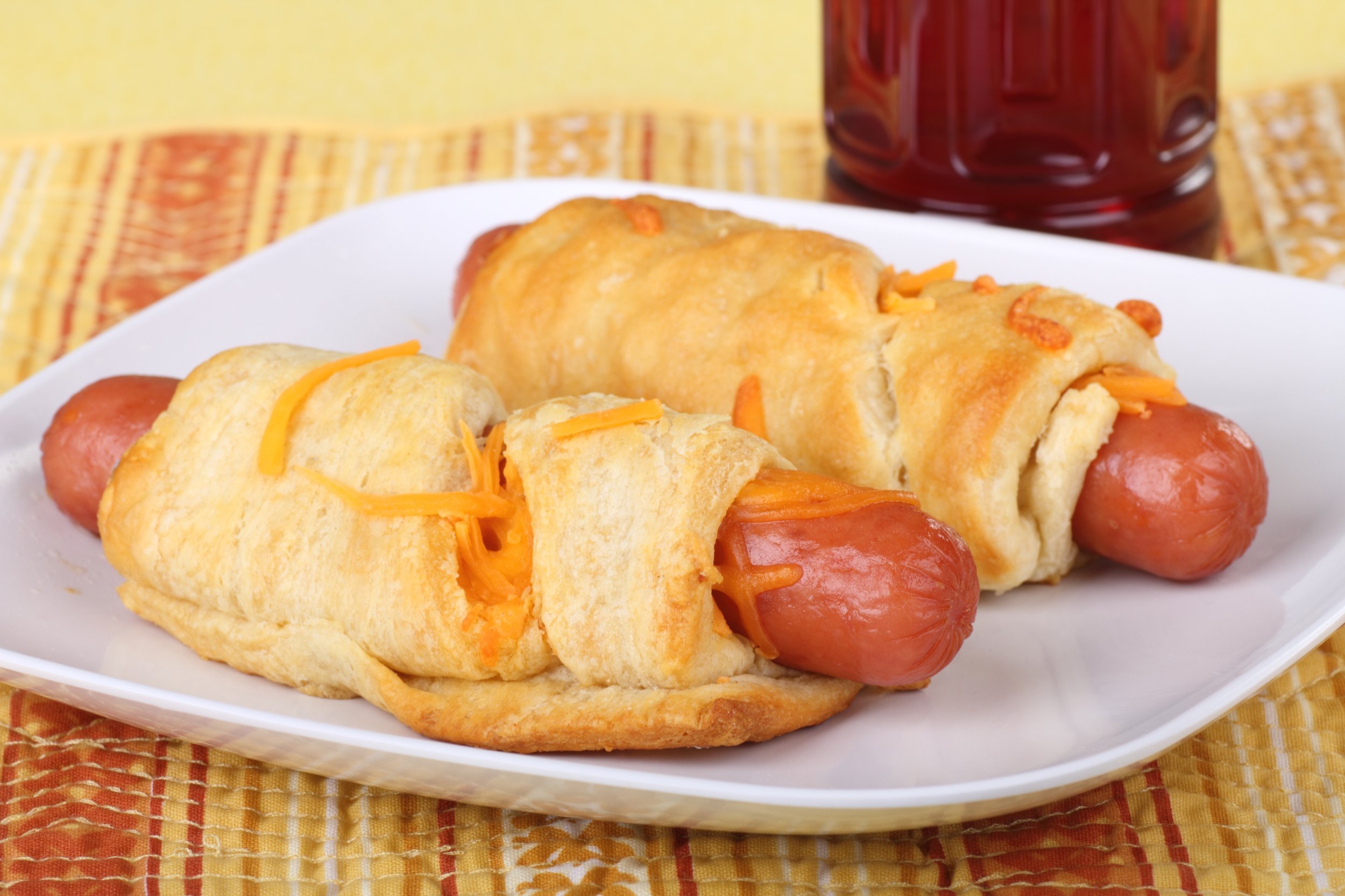 Hot dogs in a crescent rolls with melted cheese