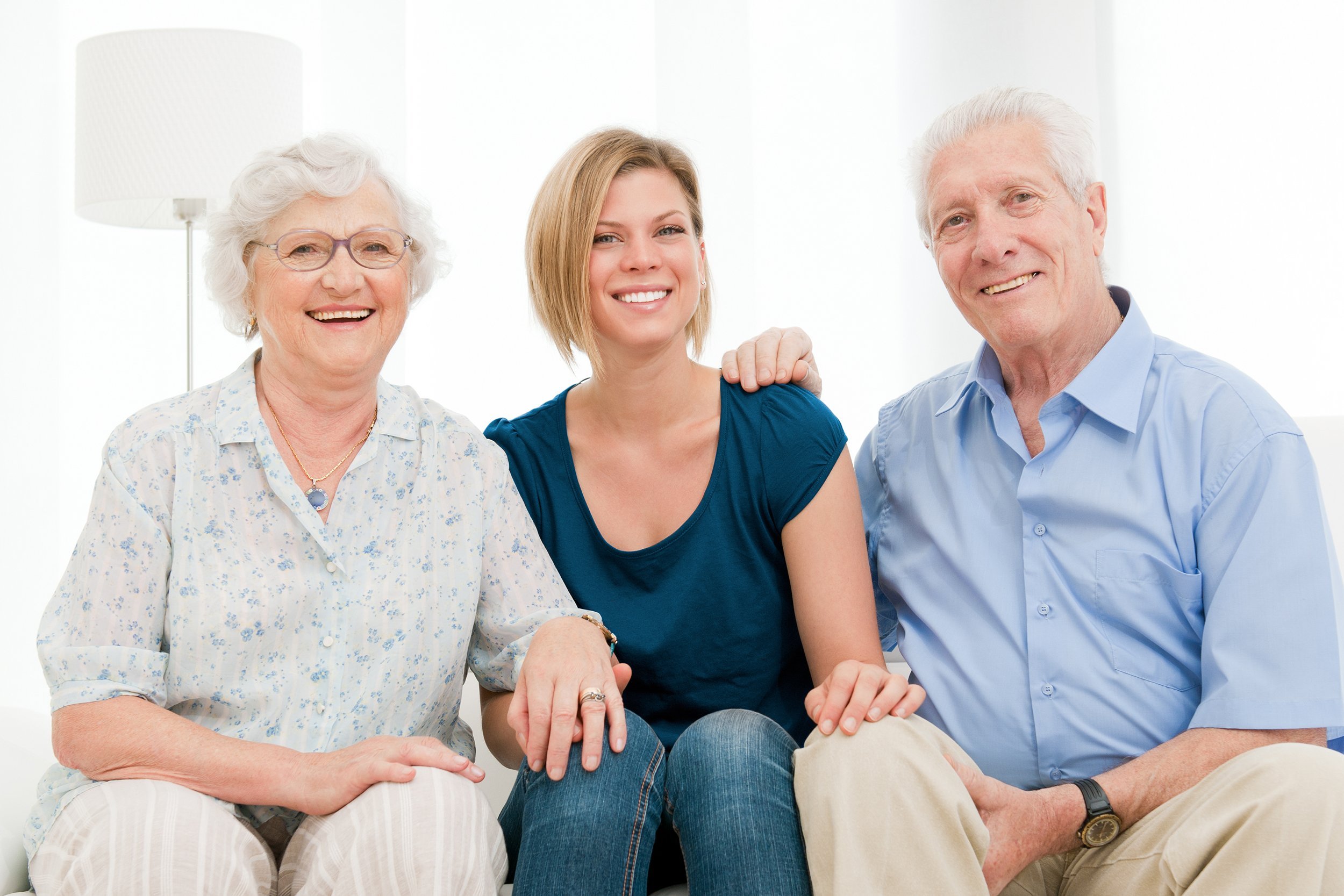 Smiling happy family with granddaughter and grandparents