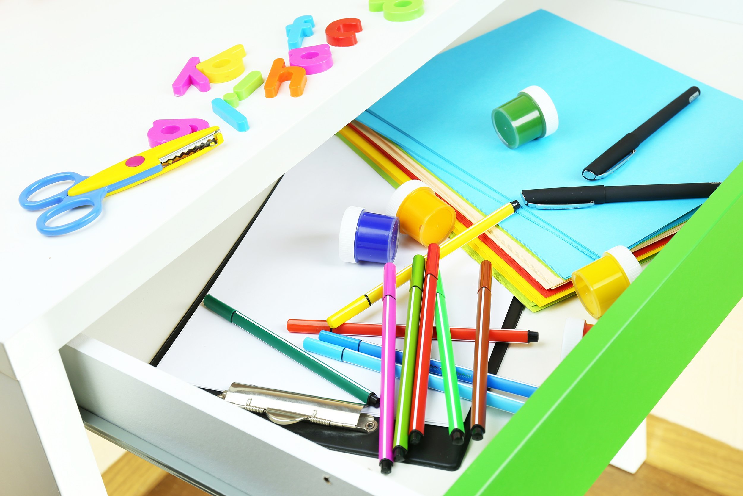 desk drawer full of school supplies