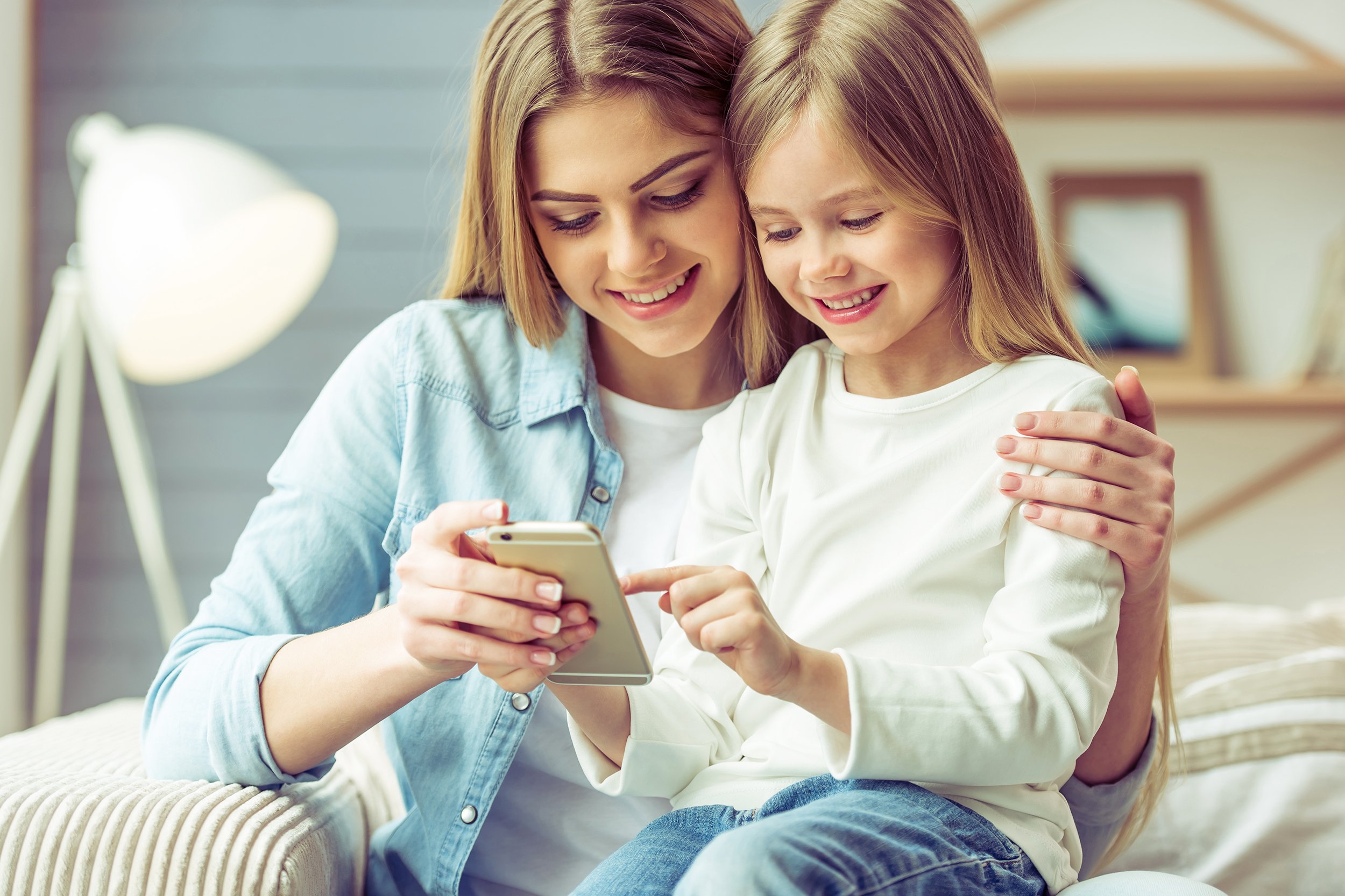 mother and daugher on cell phone