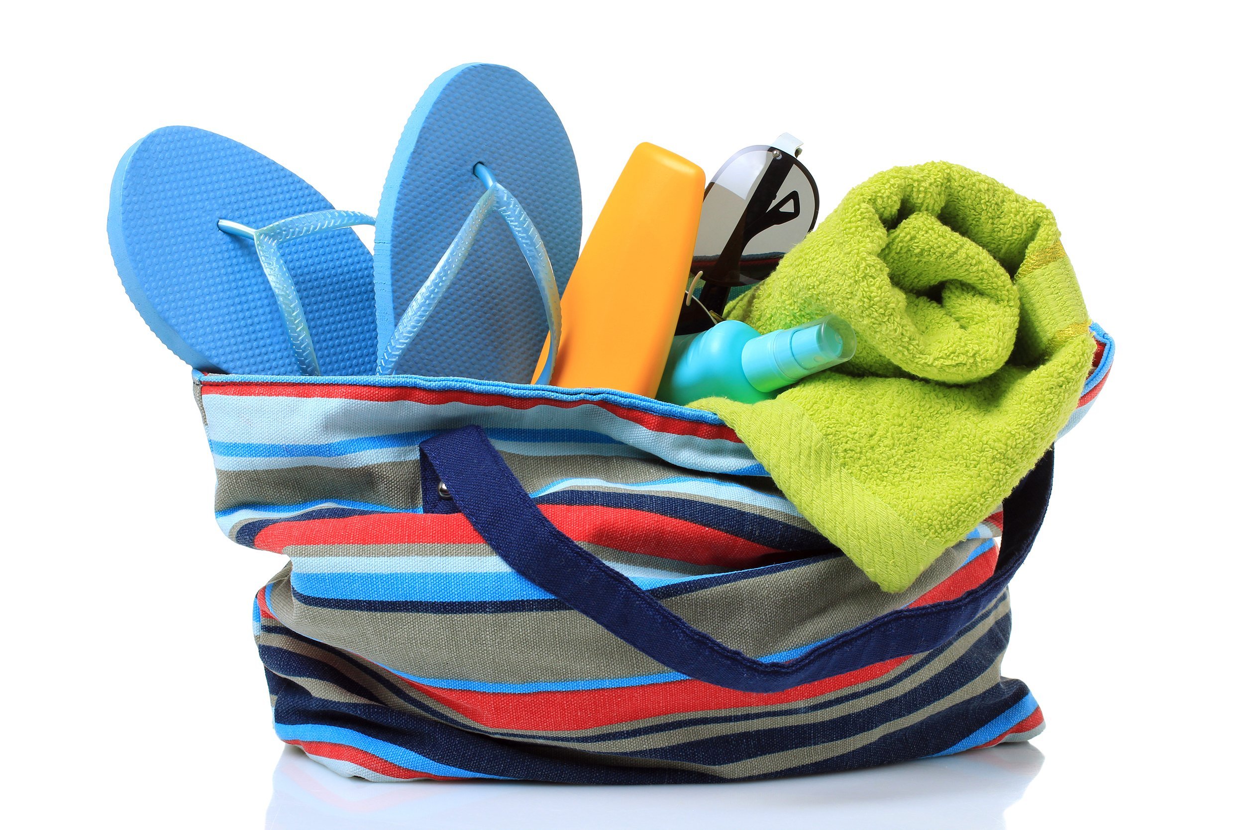 beach bag with sunscreen, towel, and flip flops