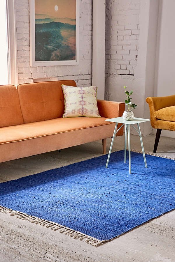 Blue rug on floor of an apartment