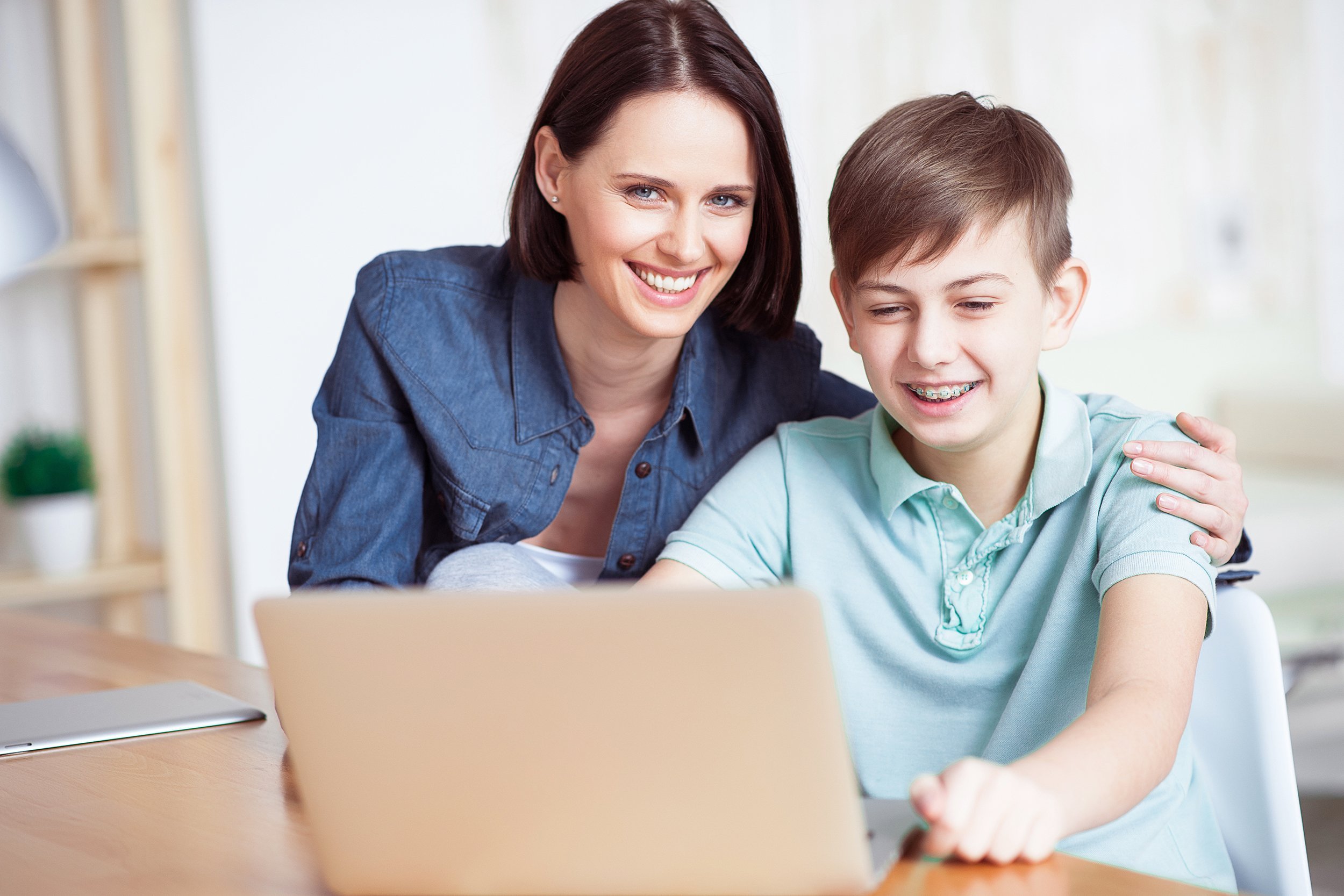 mother helping son with homework