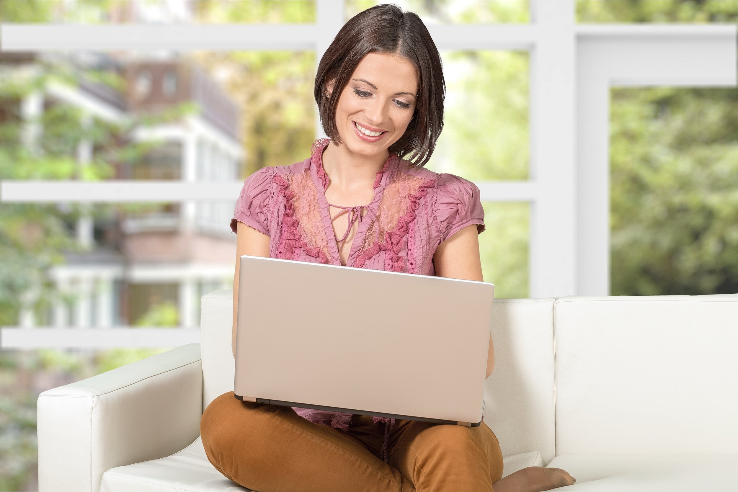 woman on laptop in her home
