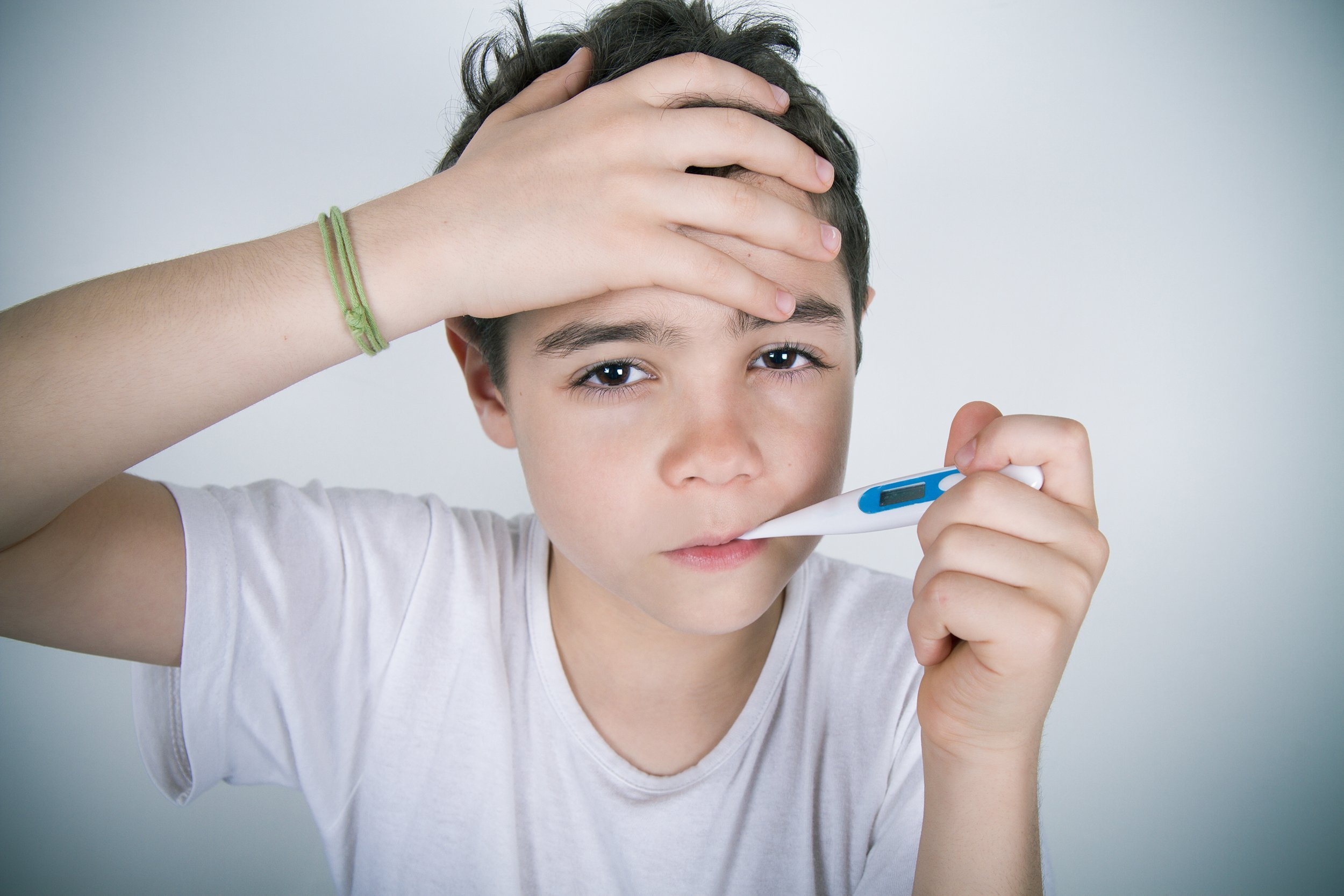 hispanic little boy with fever