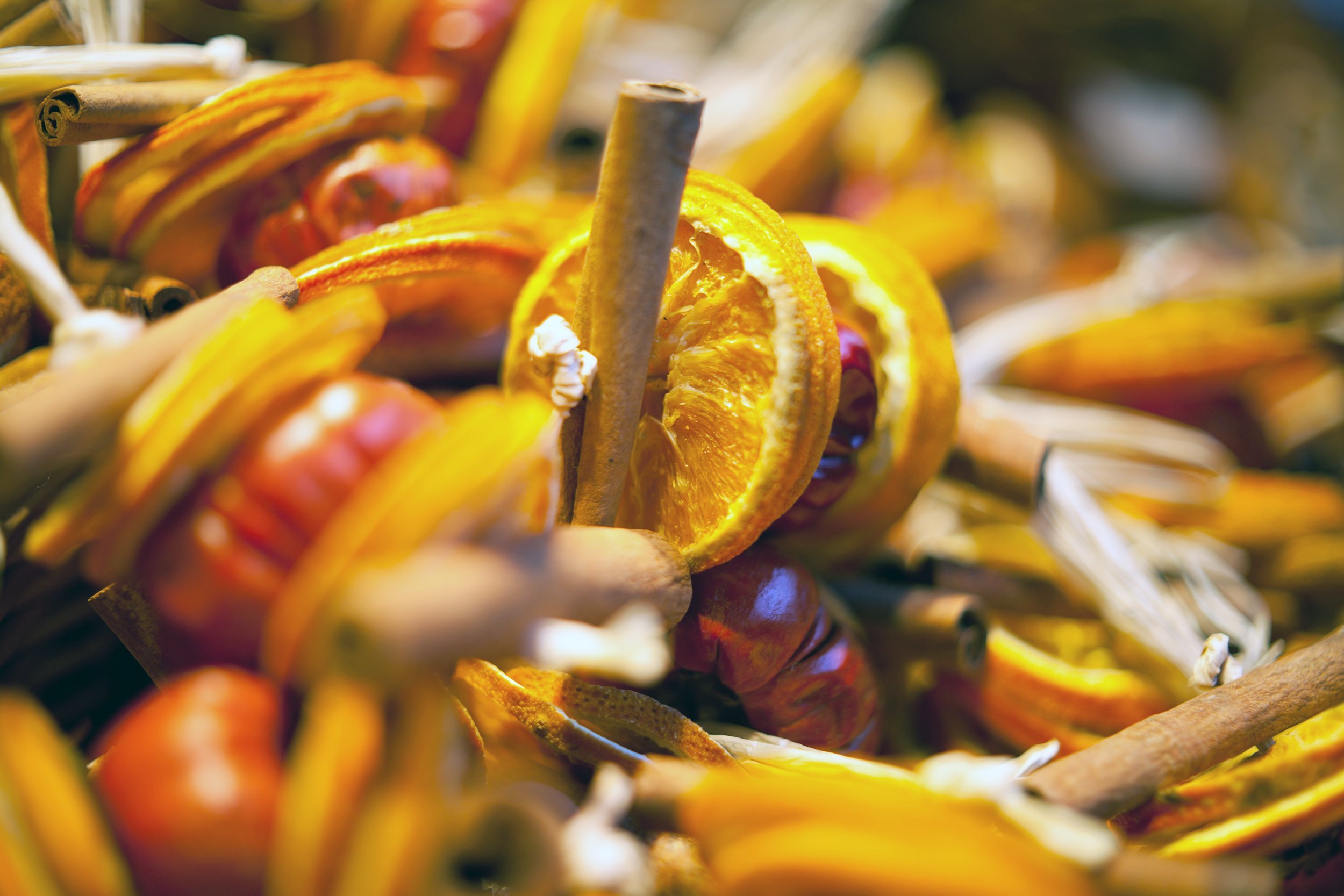 apple slices, orange peels, and cinnamon sticks