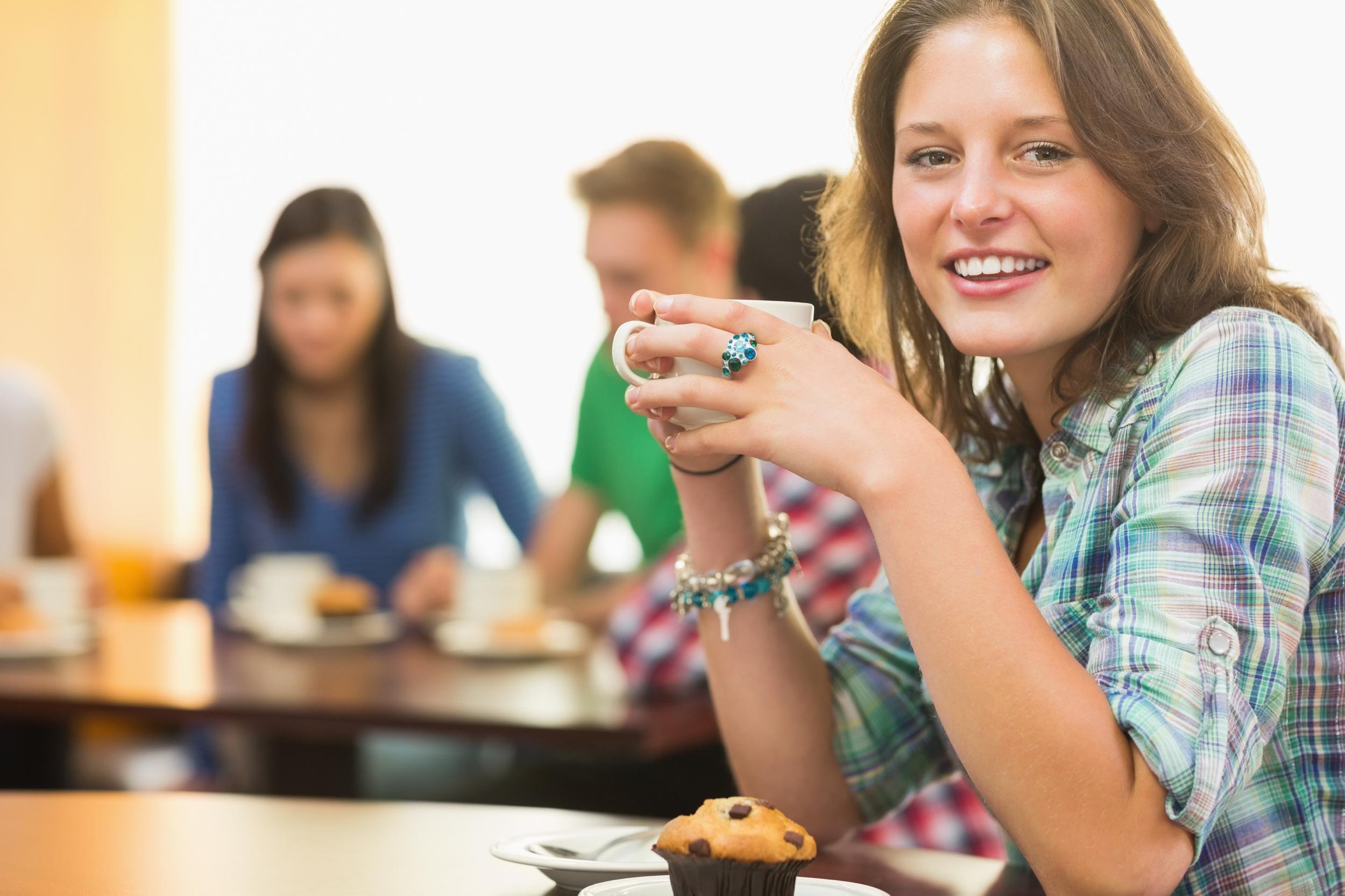 college girl eating on campus