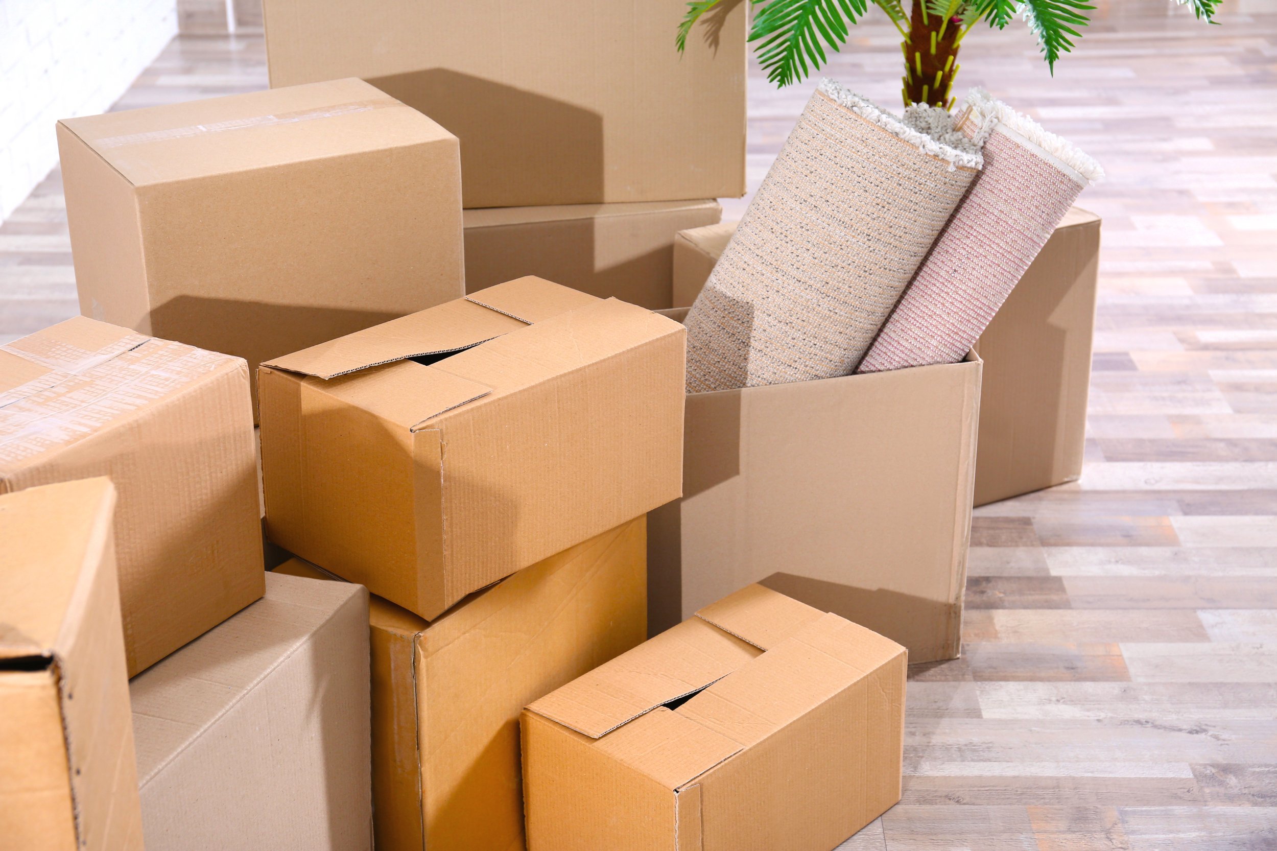 Pile of boxes for moving in office.