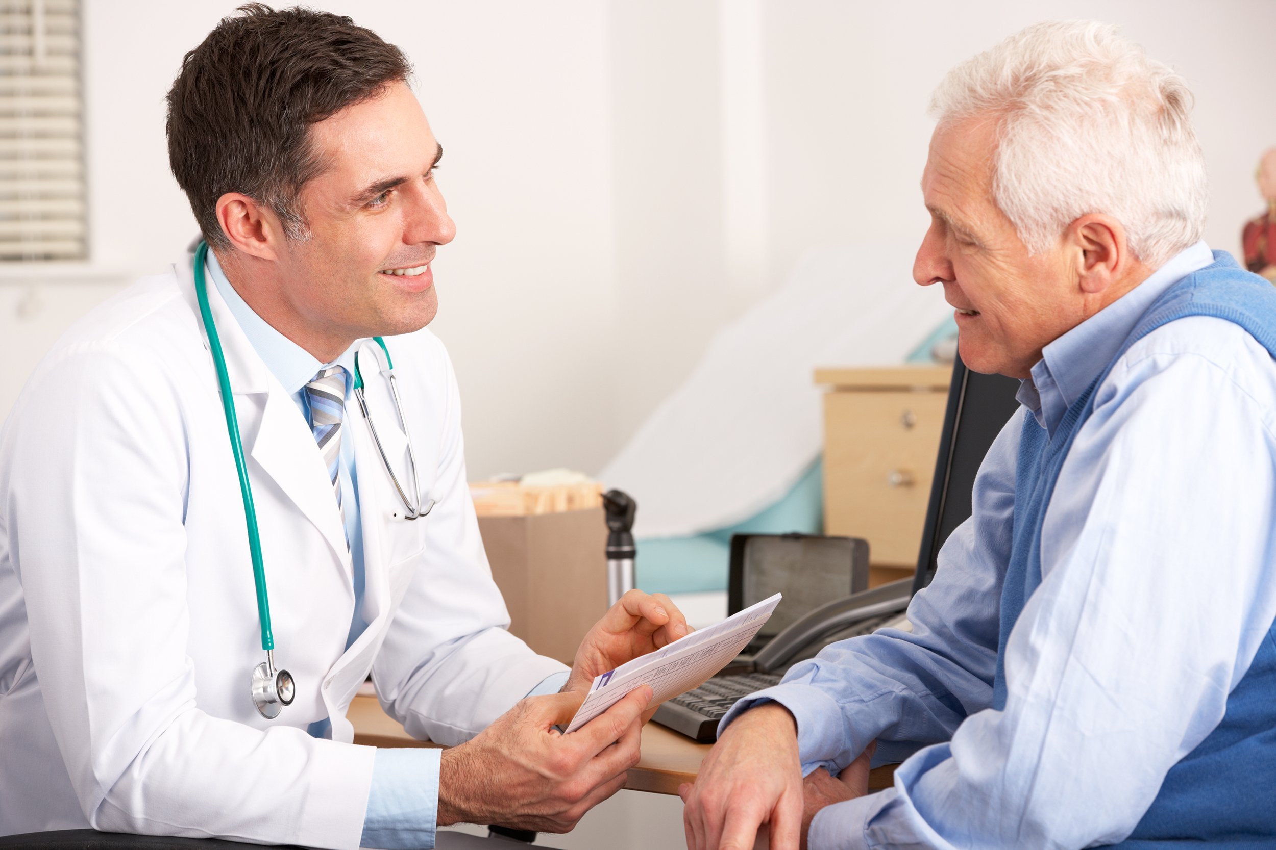 doctor talking to senior man