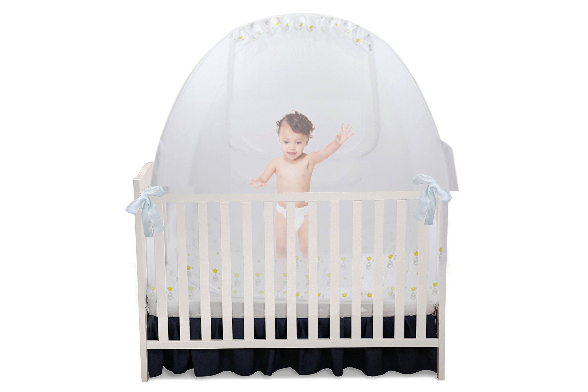 Child in a crib with a tent covering