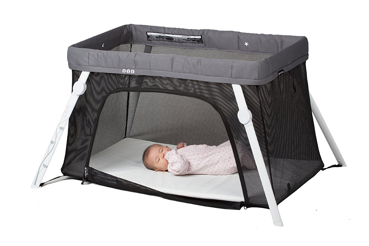 Sleeping baby in a playpen