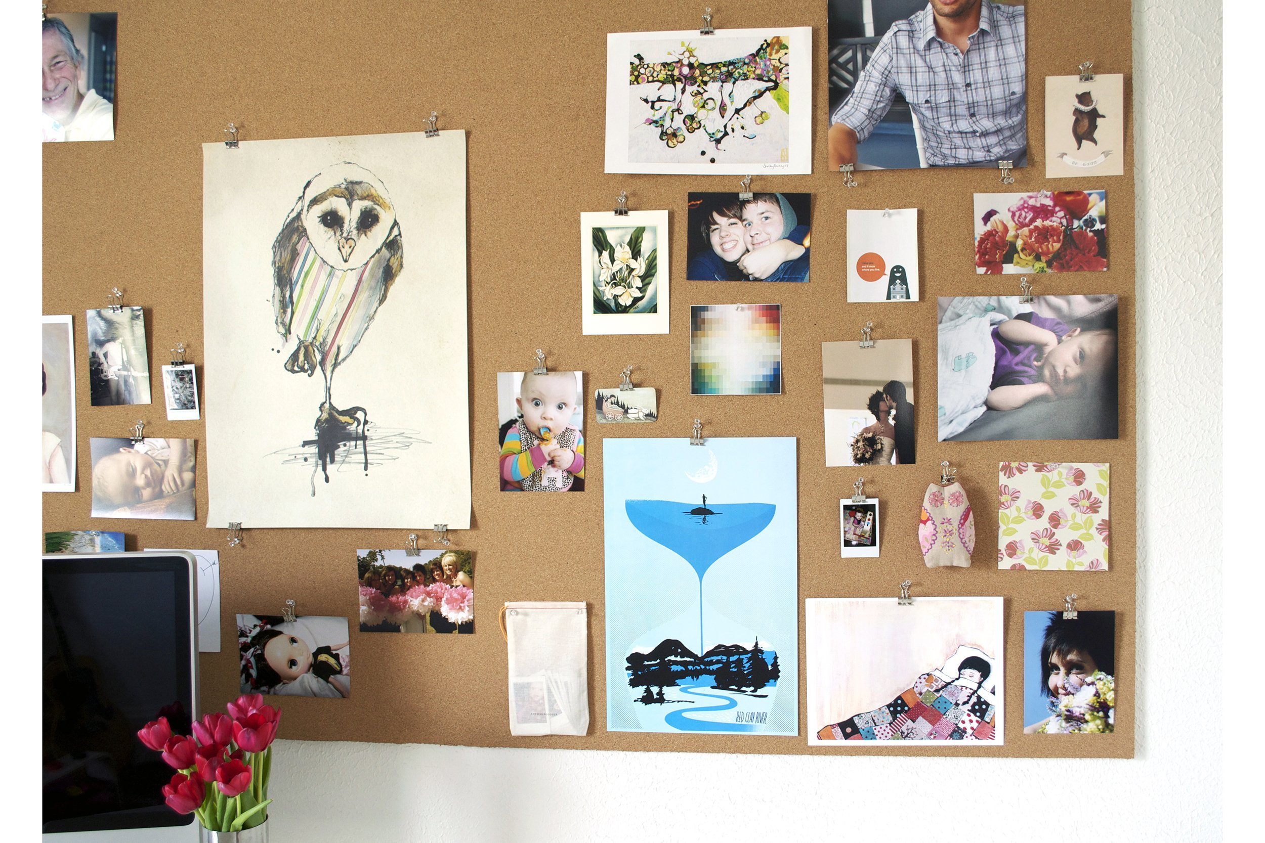 Pinboard with lots of photos and other items