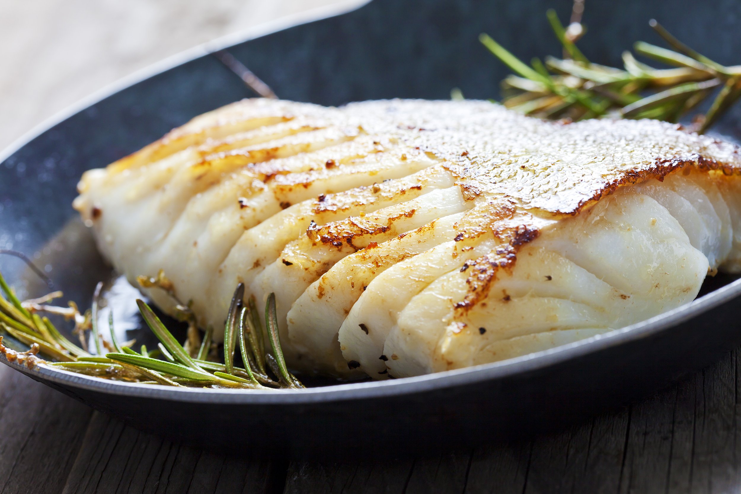 Atlantic cod with rosemary in pan