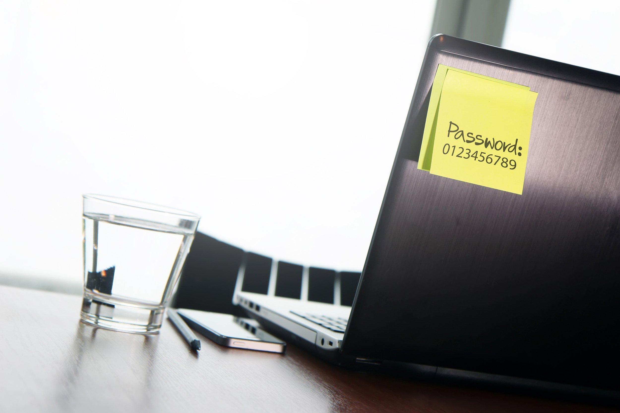 easy password on sticky note on back laptop