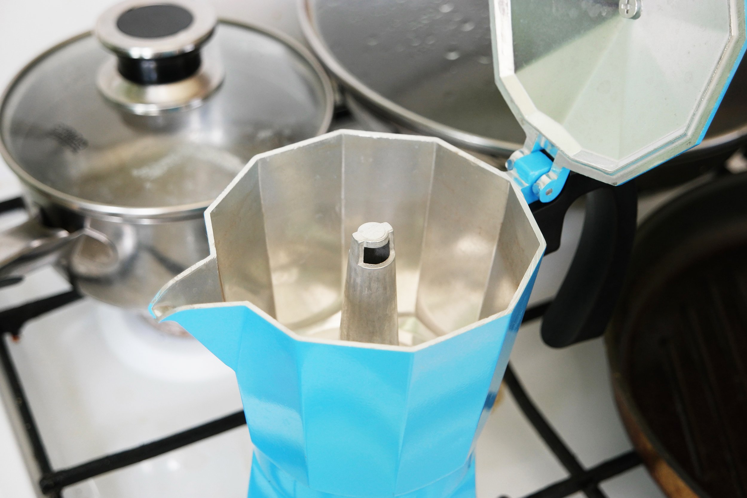 blue moka pot with open cover closeup