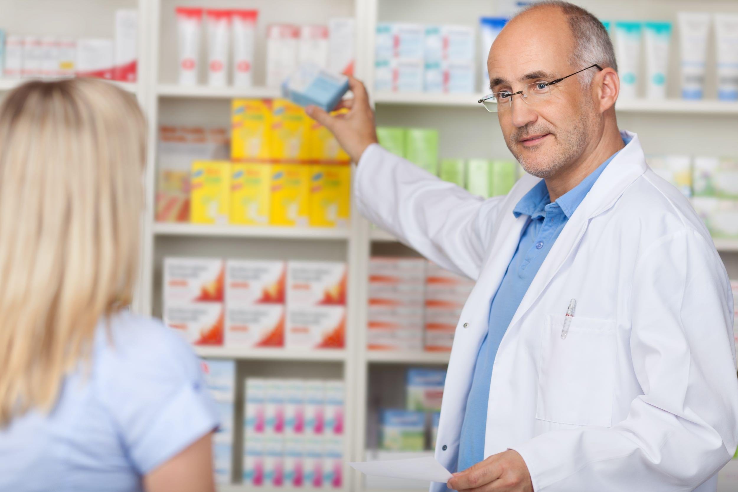 pharmacist helping customer