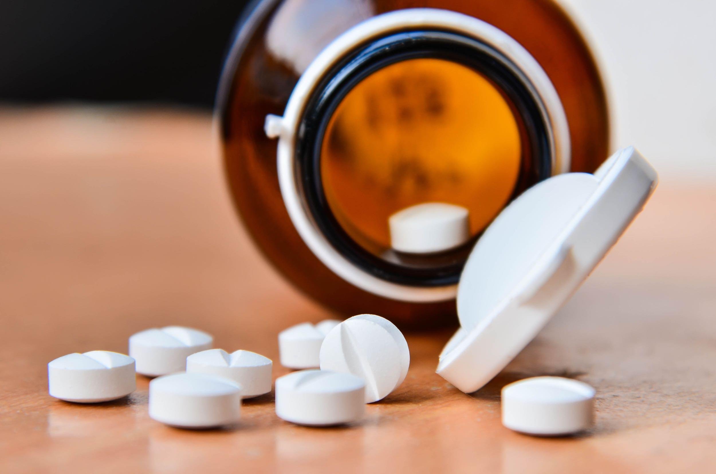 bottle of medicine on table