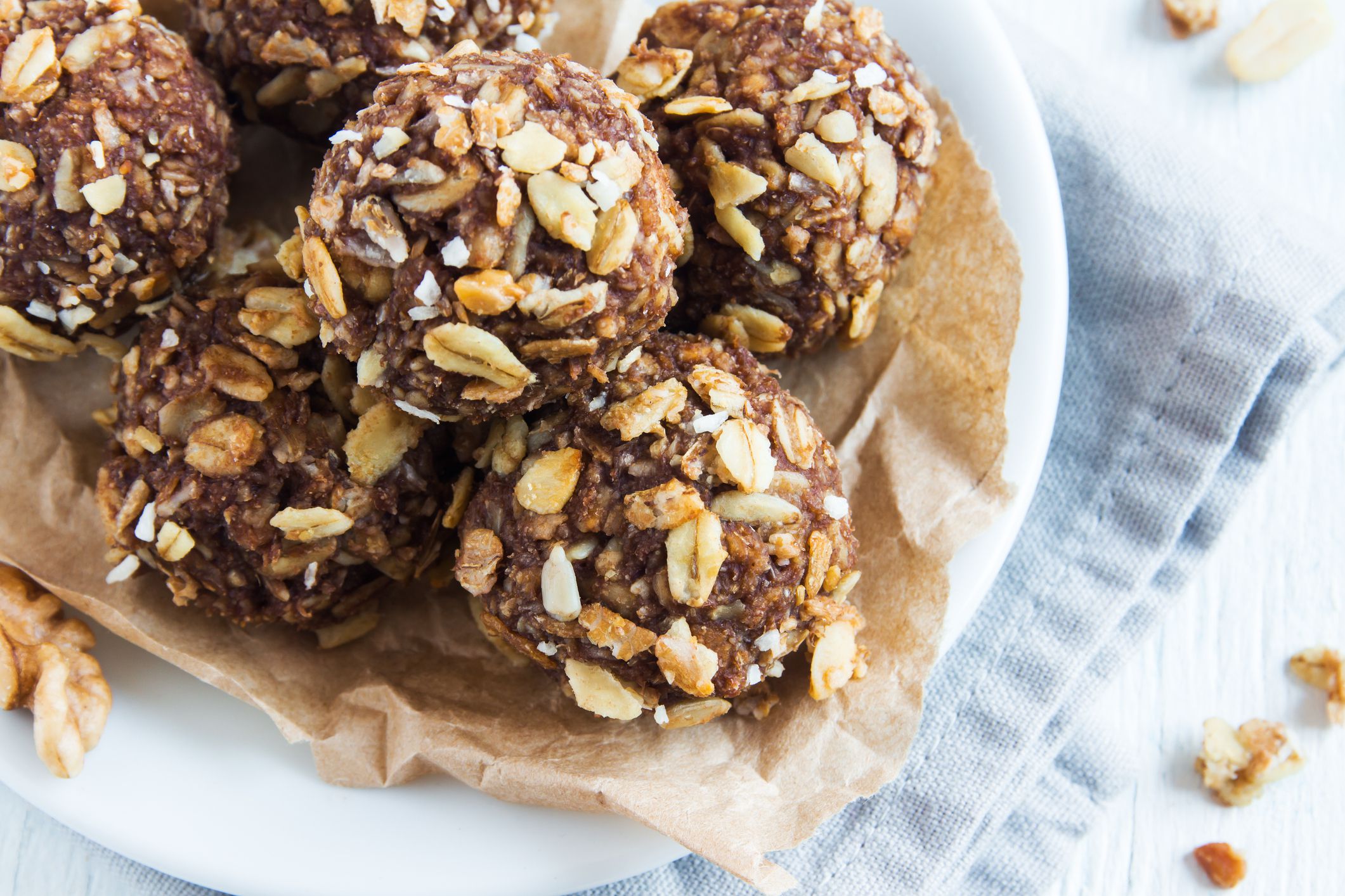 Healthy organic energy granola bites with nuts, cacao, banana and honey - vegan vegetarian raw snack or meal
