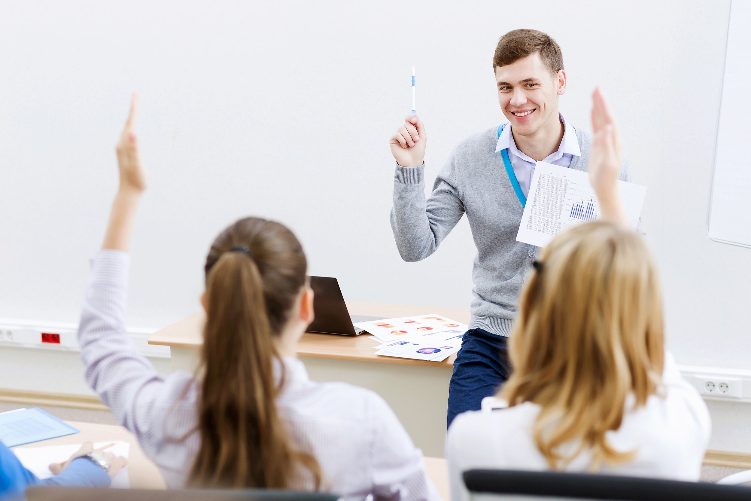 male teacher teaching class