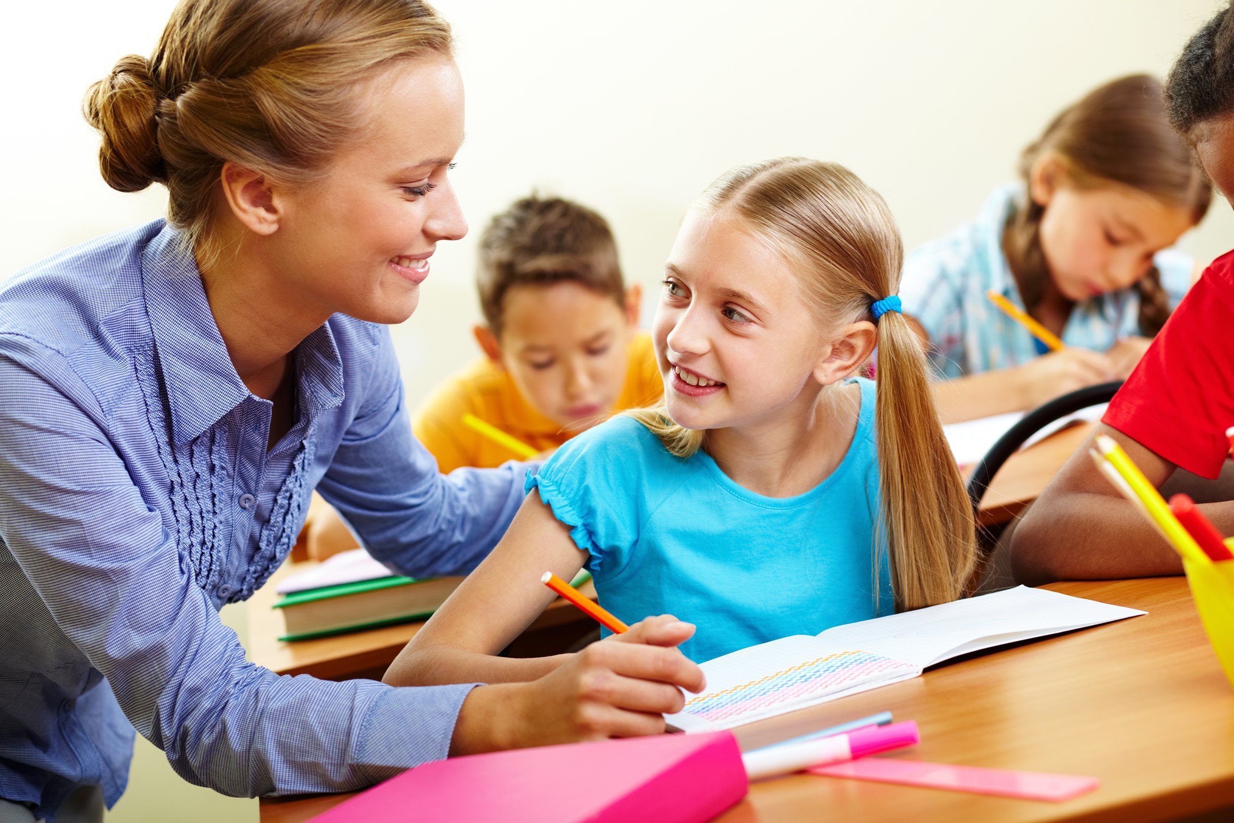 female teacher helping female teacher