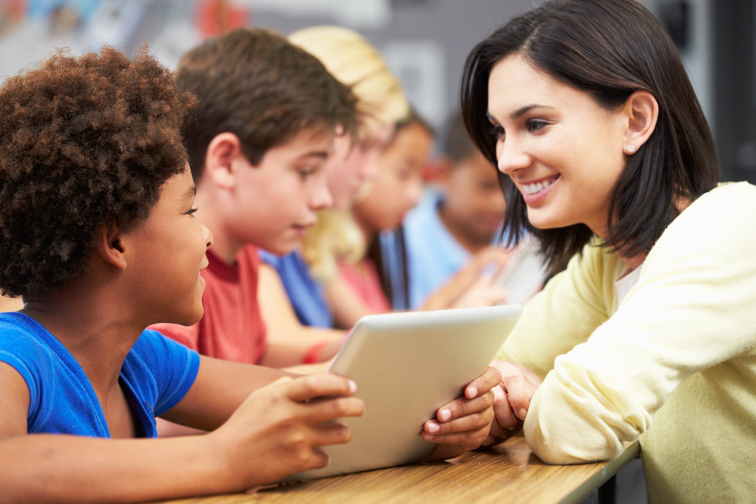female teacher teaching kids
