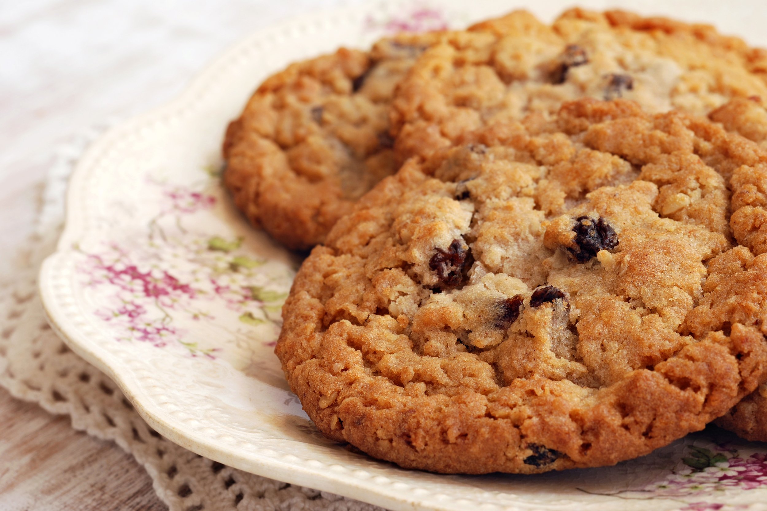 Oatmeal raisin cookies on an antique plate