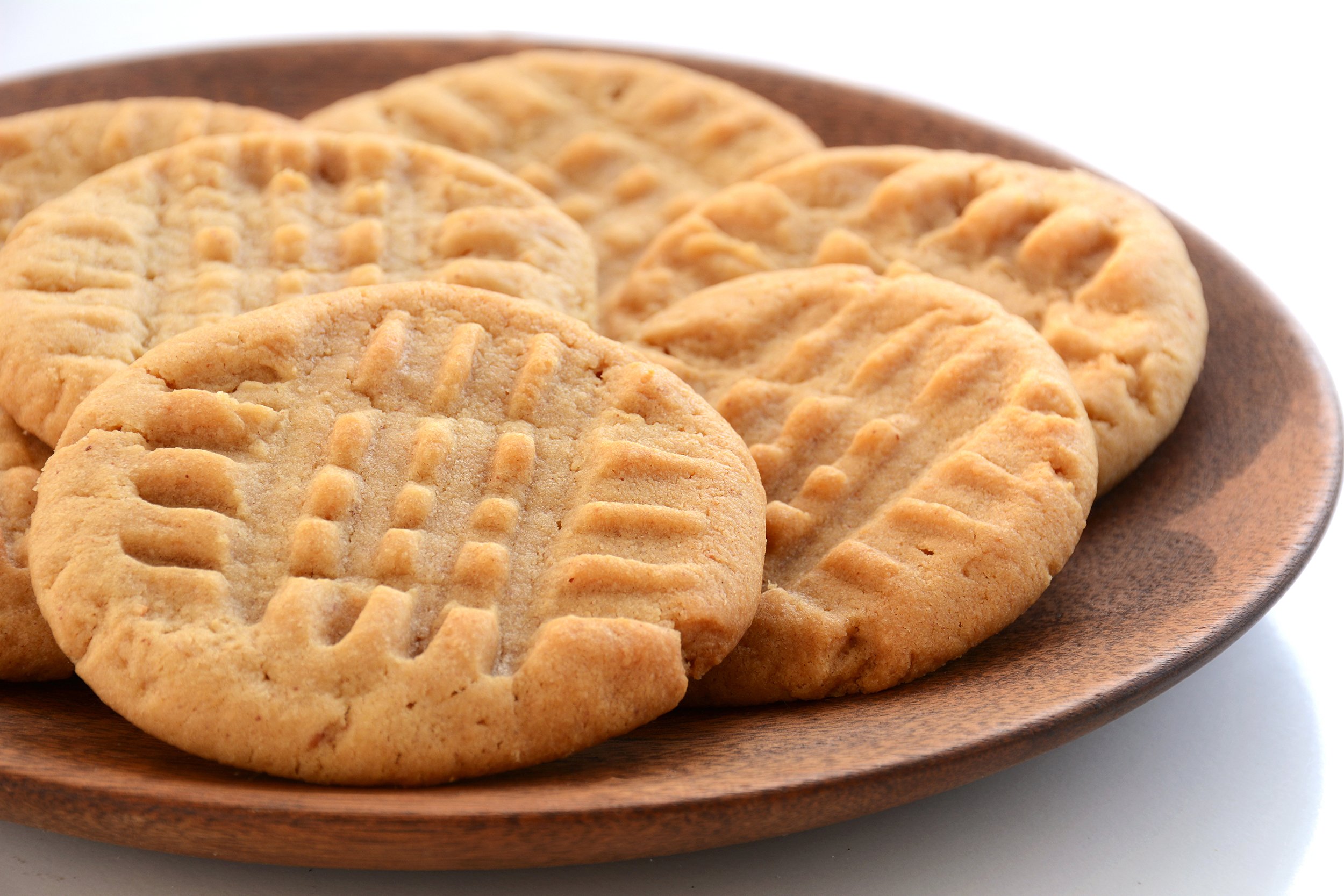 Peanut butter cookies on a wooden plate