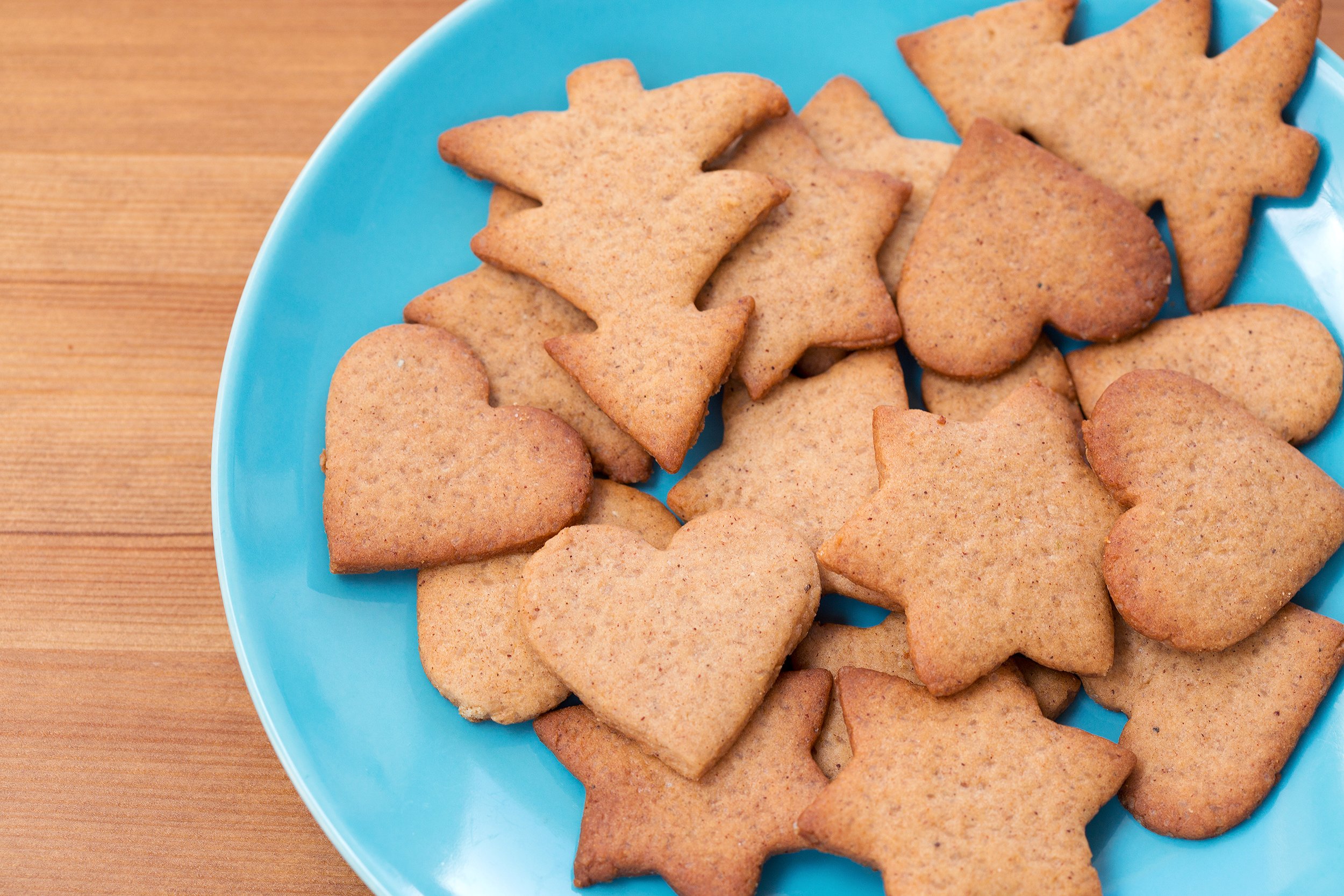 Assorted shapes of gingerbread cookies on a plate