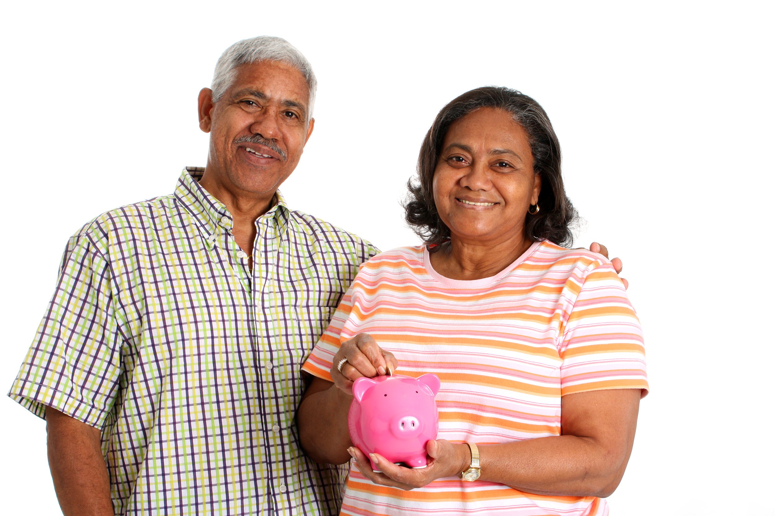 Senior couple on a white background holding a piggy bank