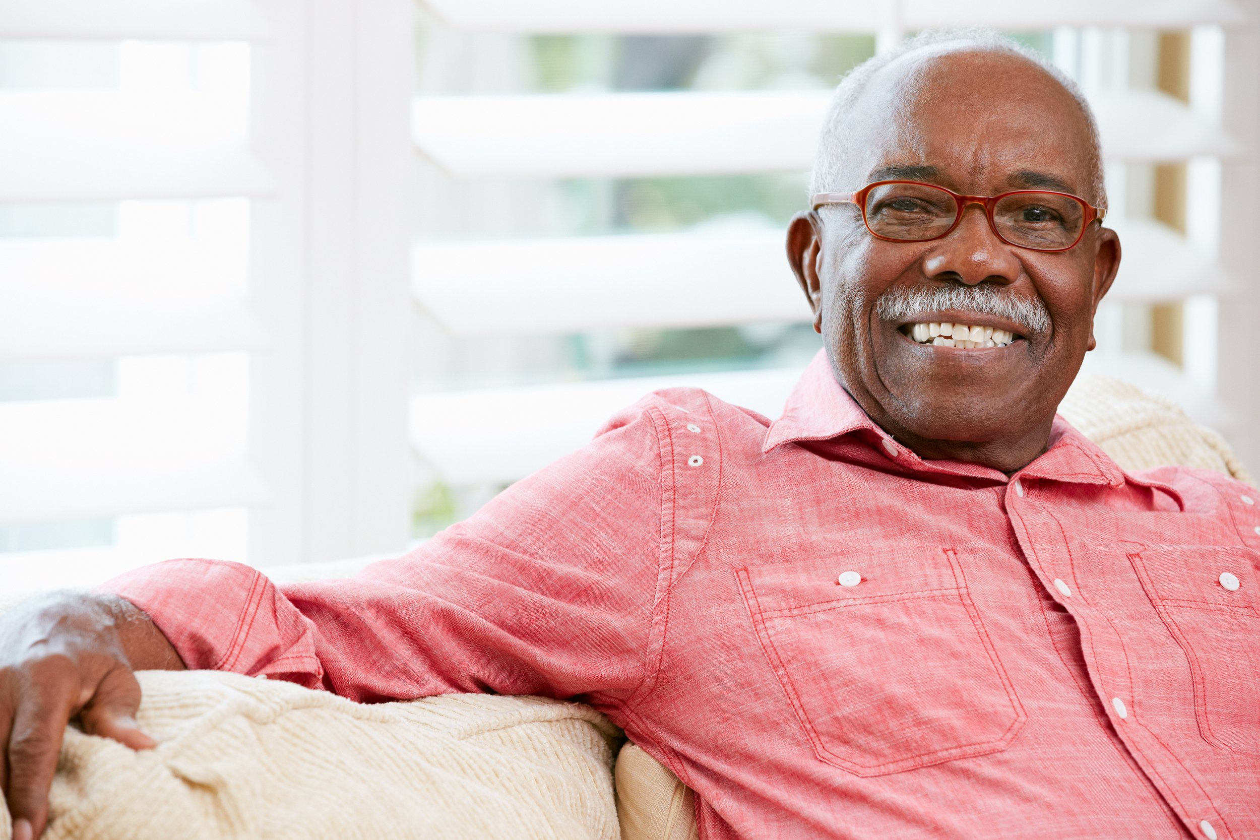 Happy senior man at home