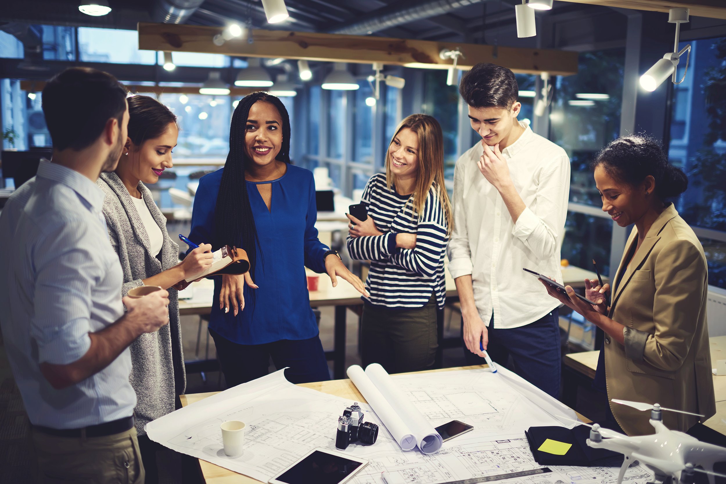 Group of young employees working on a project in an office