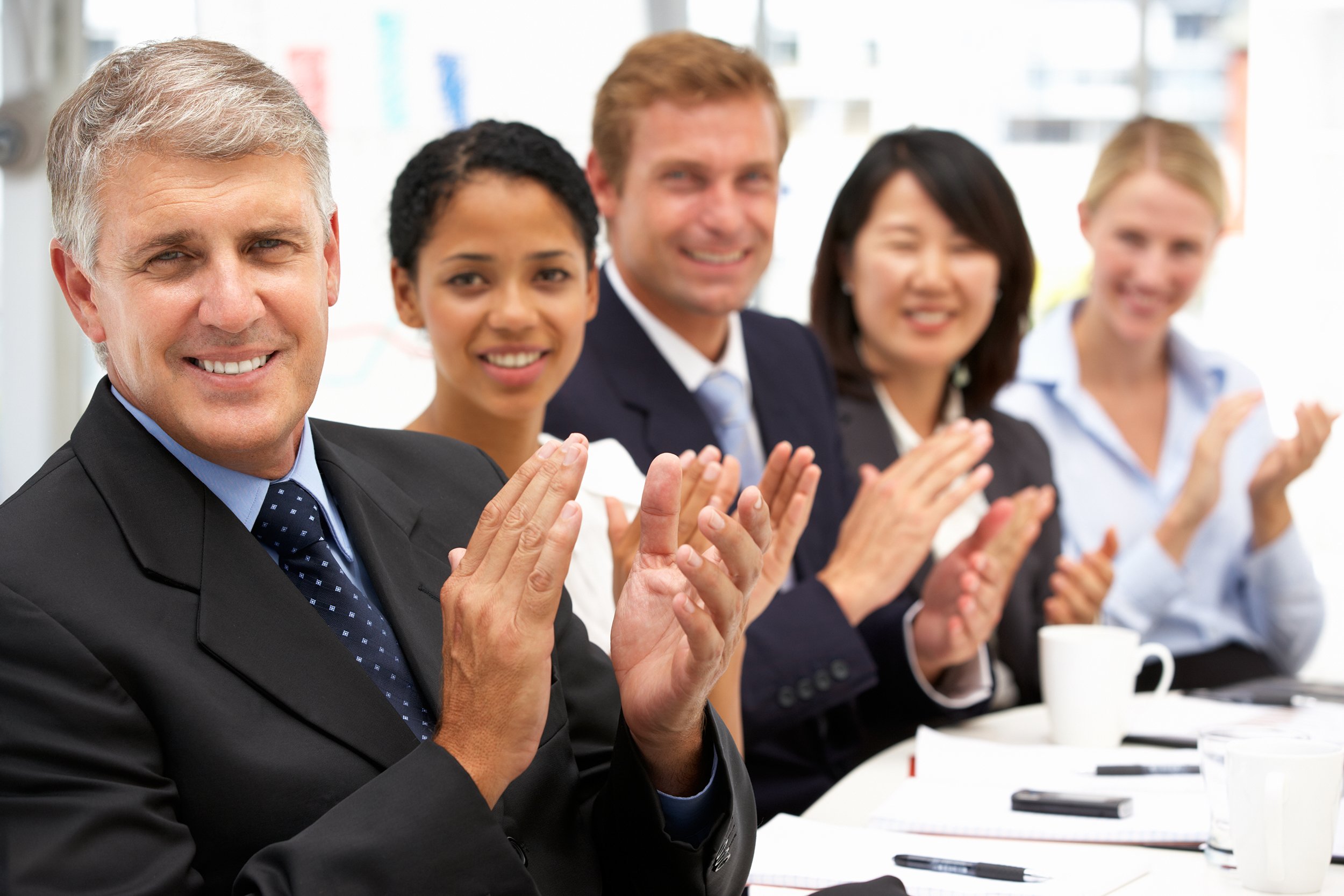 Business people clapping