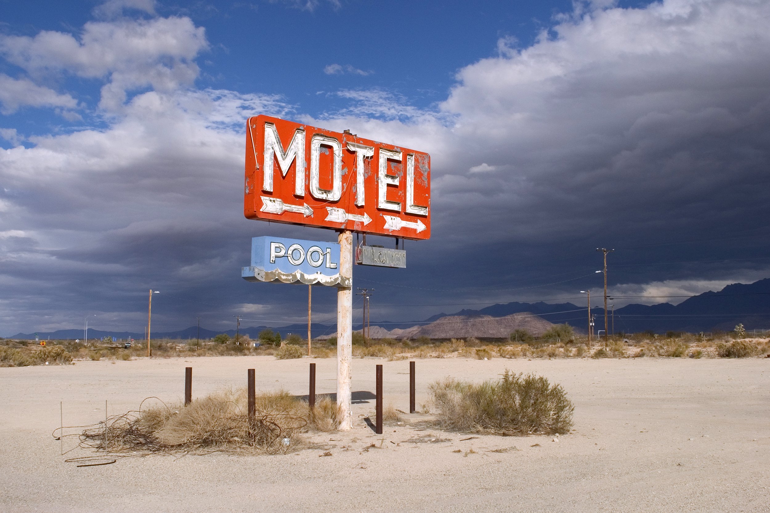 Old motel sign in the middle of nowhere desert