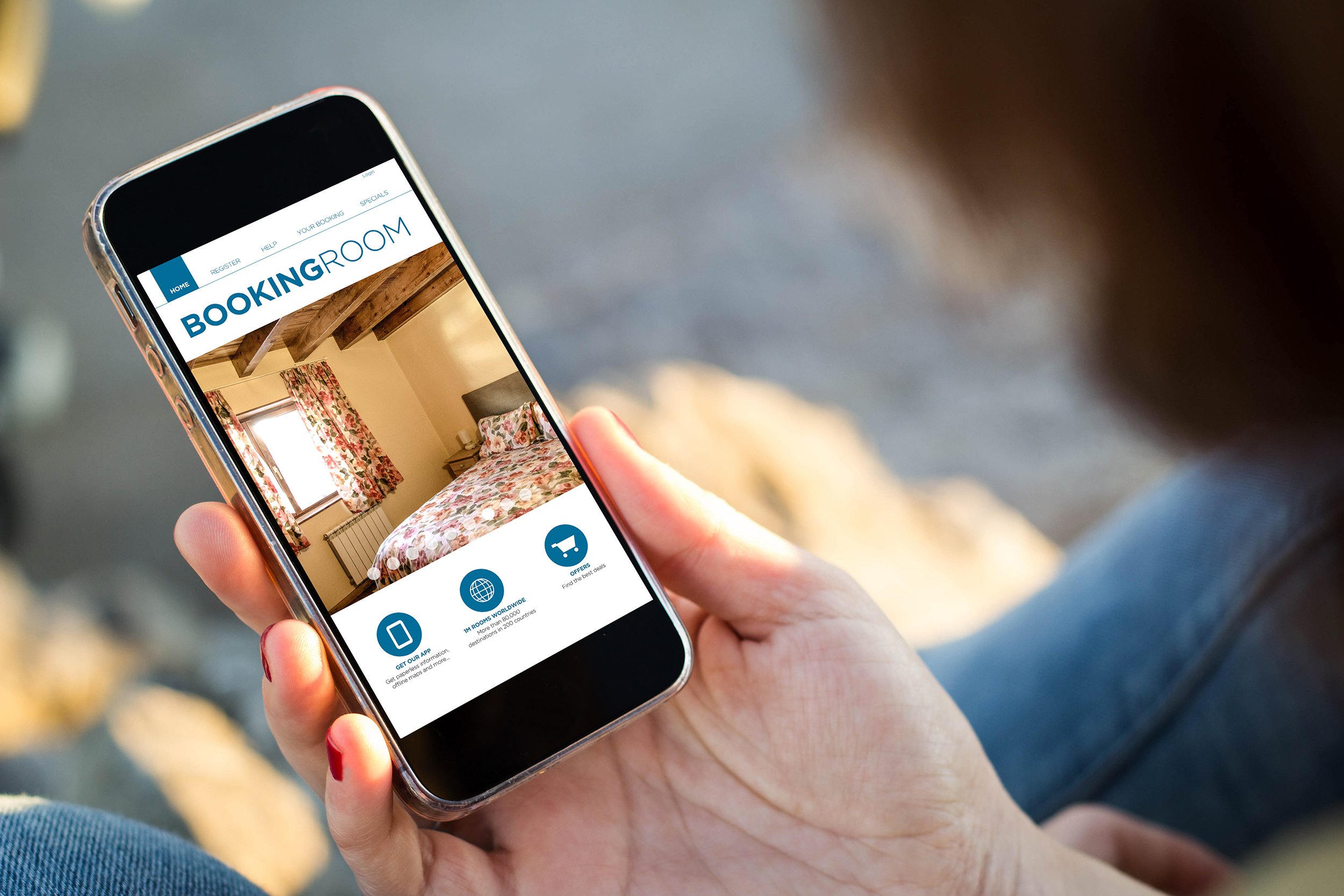 Closeup of woman using a hotel booking app on her phone