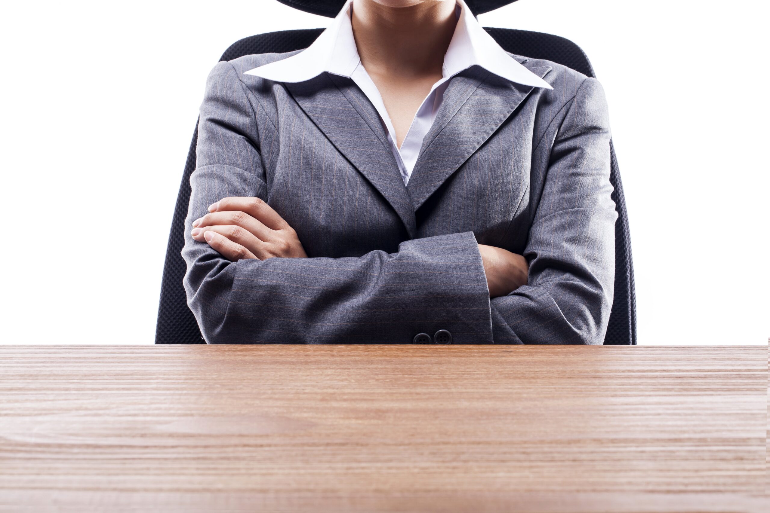 Business woman sitting with arms folded