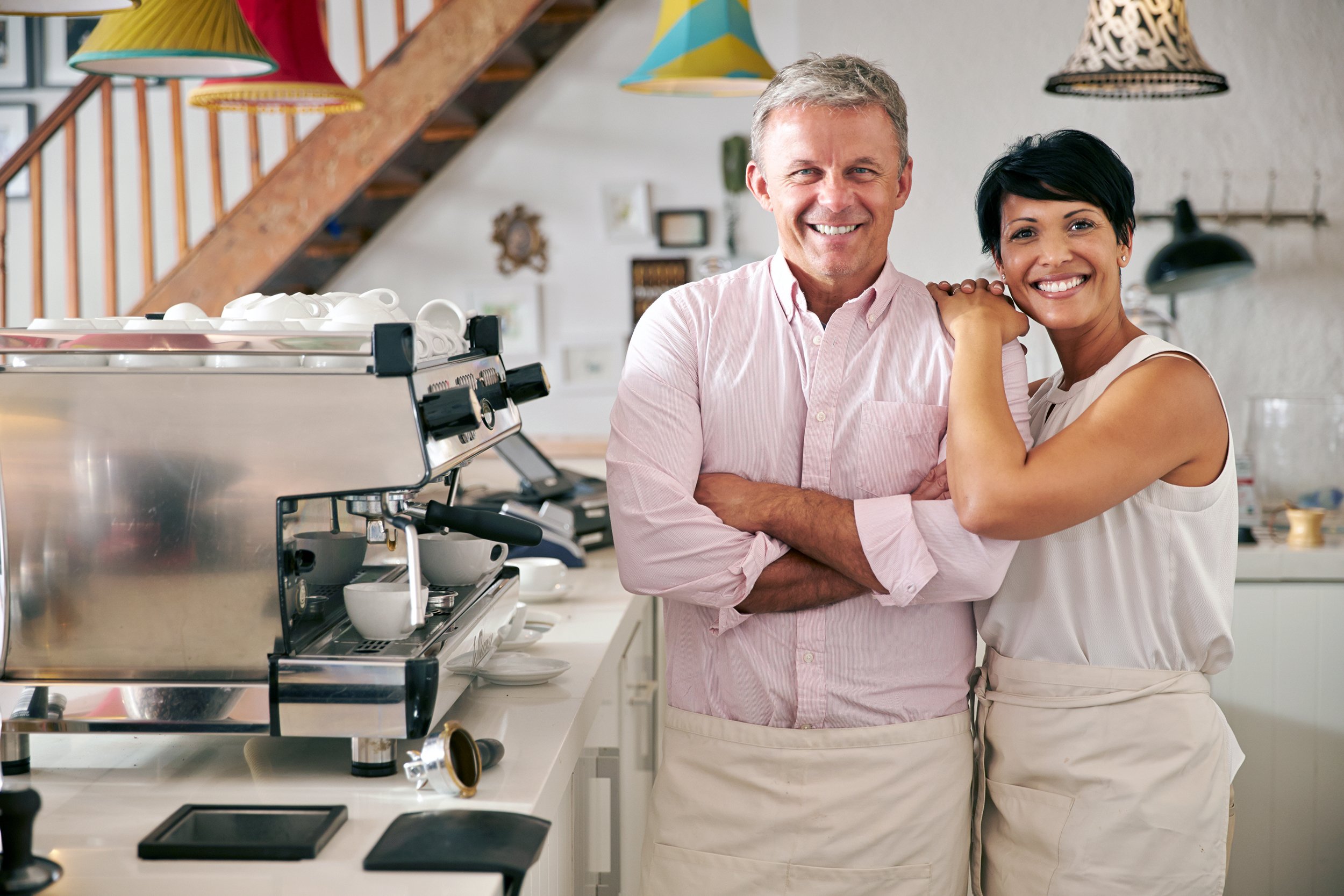 couple owners working in cafe