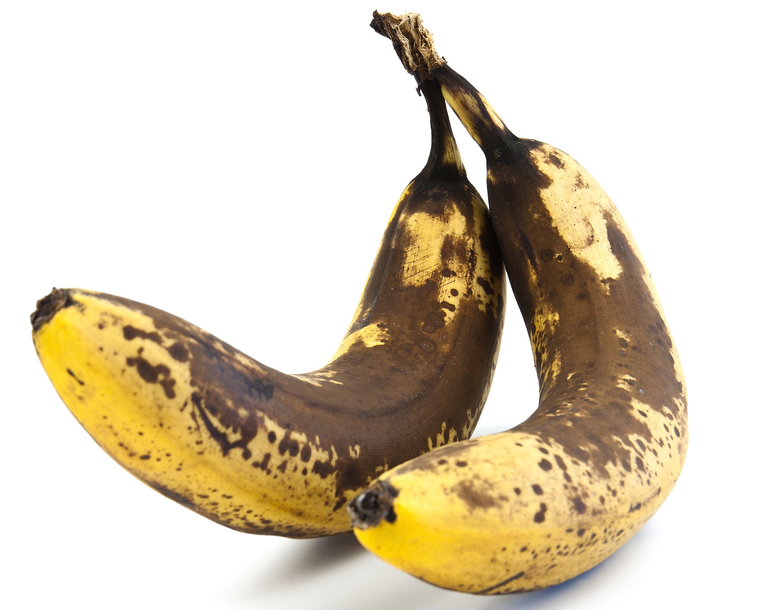 two overripe bananas with large brown spots