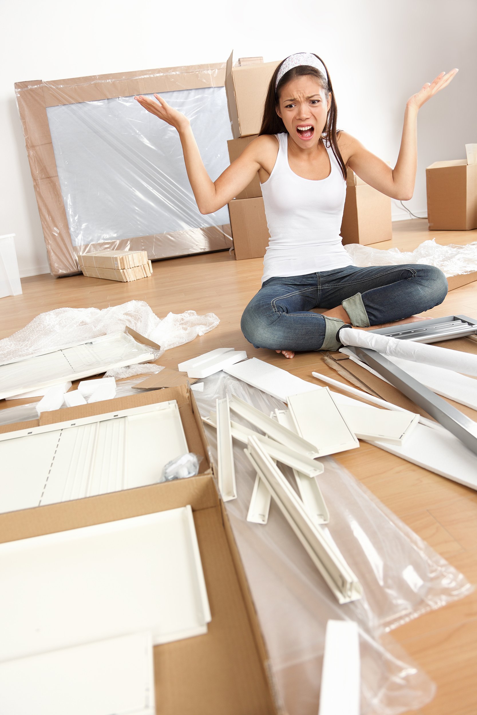 frustrated woman trying to assemble table